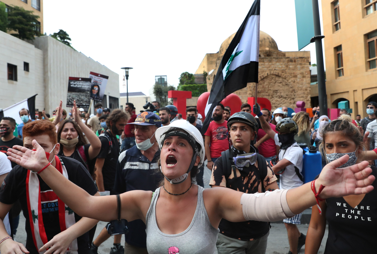 Anti-government protesters shout slogans during a protest near Parliament Square, in Beirut, Lebanon, Tuesday, Sept. 1, 2020. On a visit to Lebanon, French President Emmanuel Macron issued a stern war