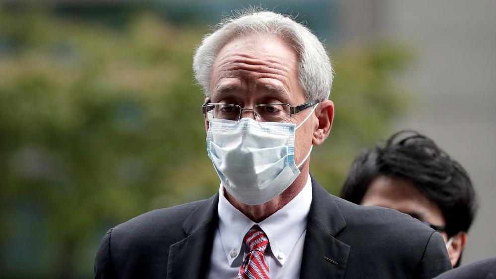 Greg Kelly, former representative director of Nissan Motor Co., arrives for the first trial hearing at the Tokyo District Court in Tokyo