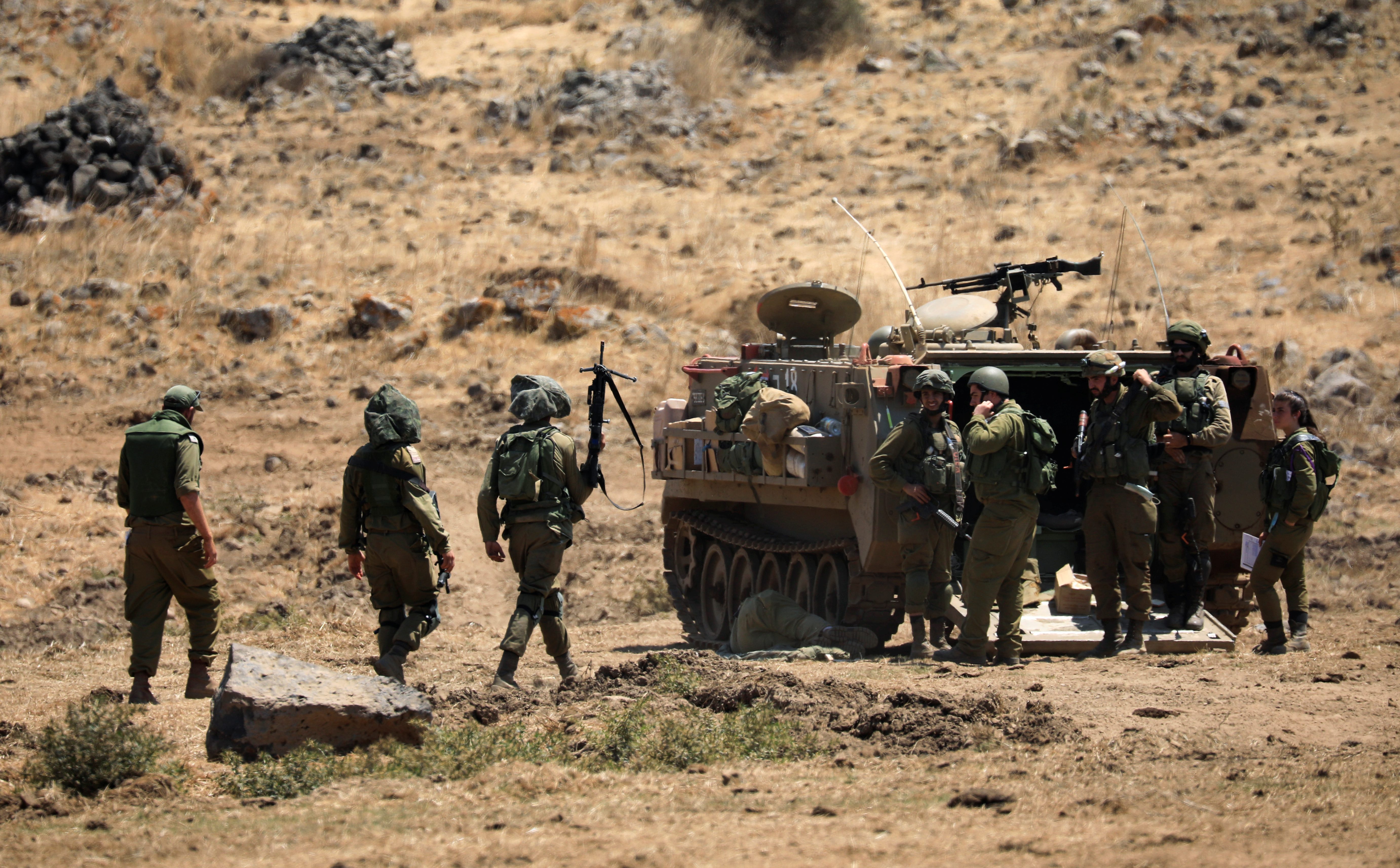 Israeli soldiers and a tank during a military drill