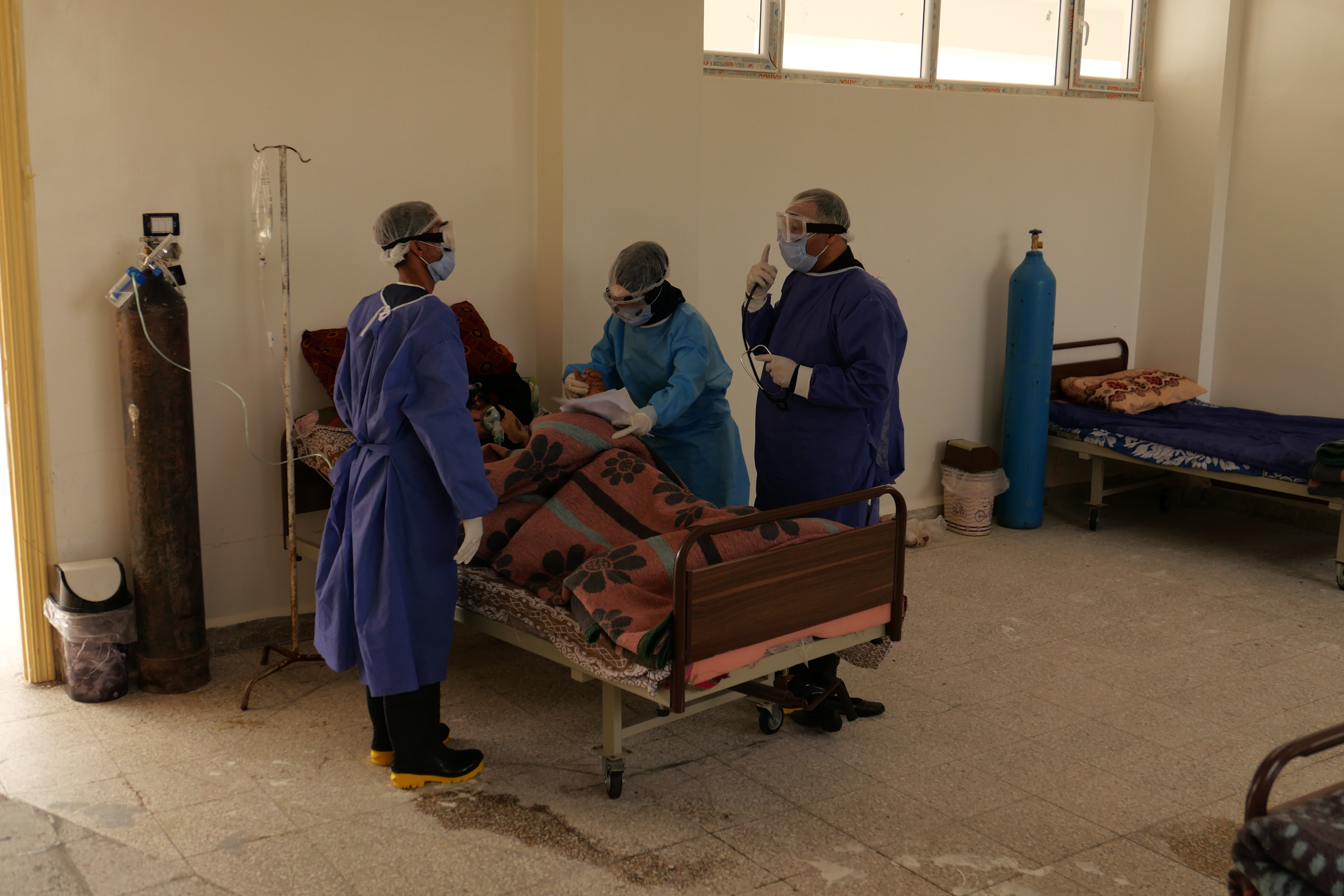 Hospital staff attend to a patient in the city of Manbij, northern Syria [Andrea Prada Bianchi/Al Jazeera]