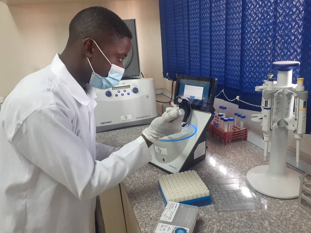Samuel Diala, manager of the repository of biological samples at the University of Ibadan, Nigeria, measures DNA samples [Photo courtesy of Dr Rufus Akinyemi]