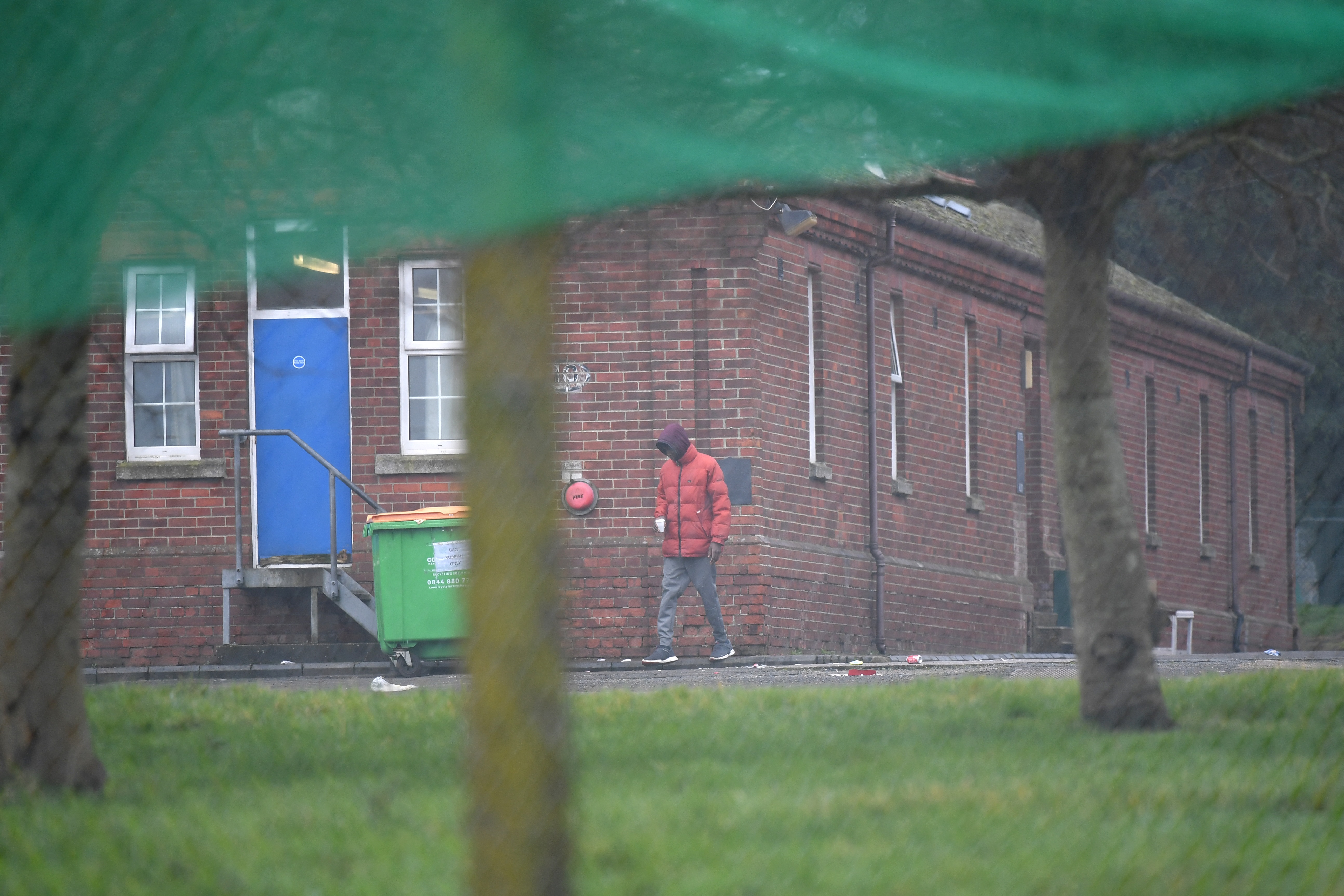 The barracks, which lie near the town of Folkestone, housed about 400 asylum seekers until a recent COVID-19 outbreak there led to some being moved into self-isolation [File: Ben Stansall/AFP]