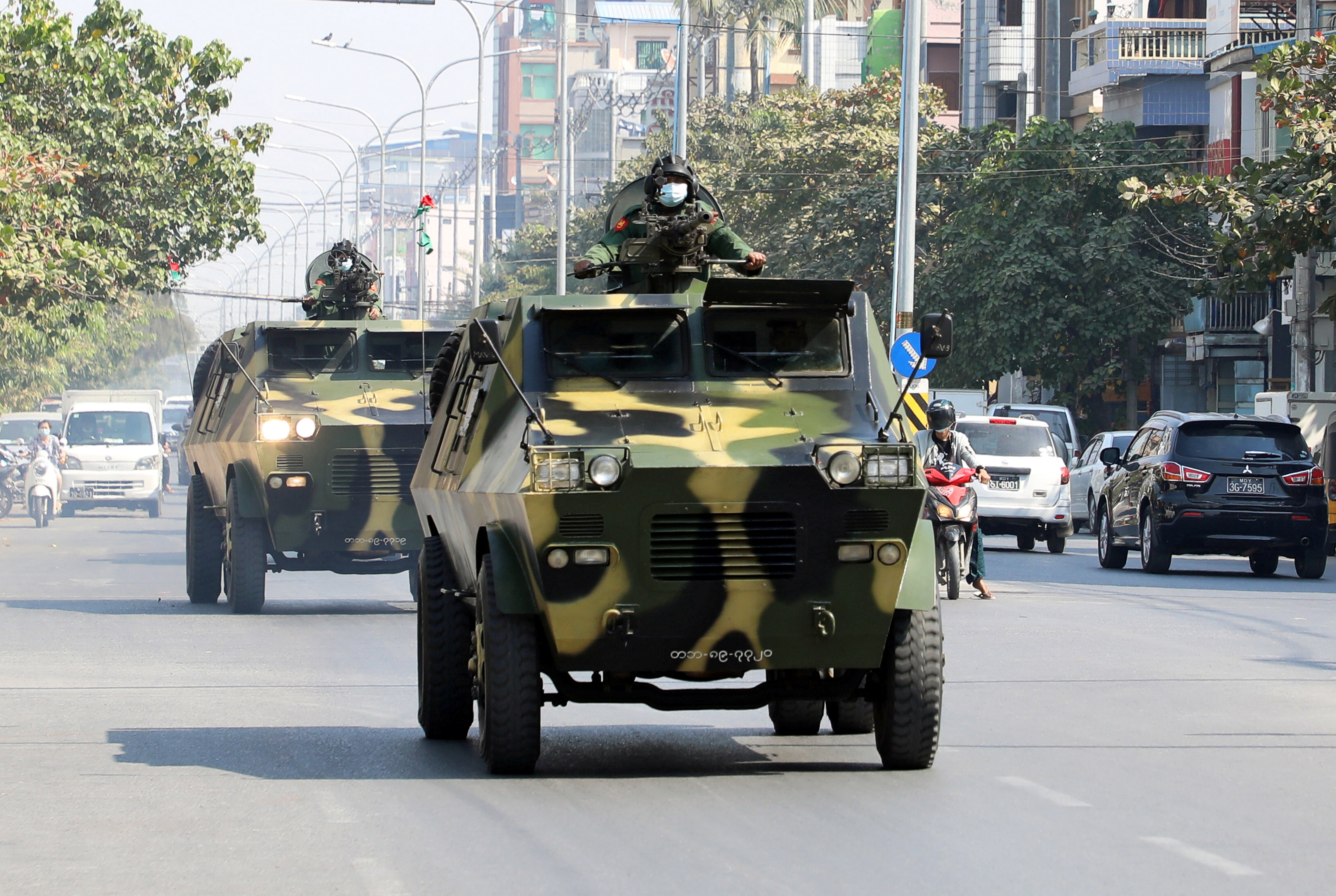Myanmar army's armoured vehicles drive in a street after the military seized power in a coup in Mandalay, Myanmar, February 3, 2021 [Stringer/Reuters]
