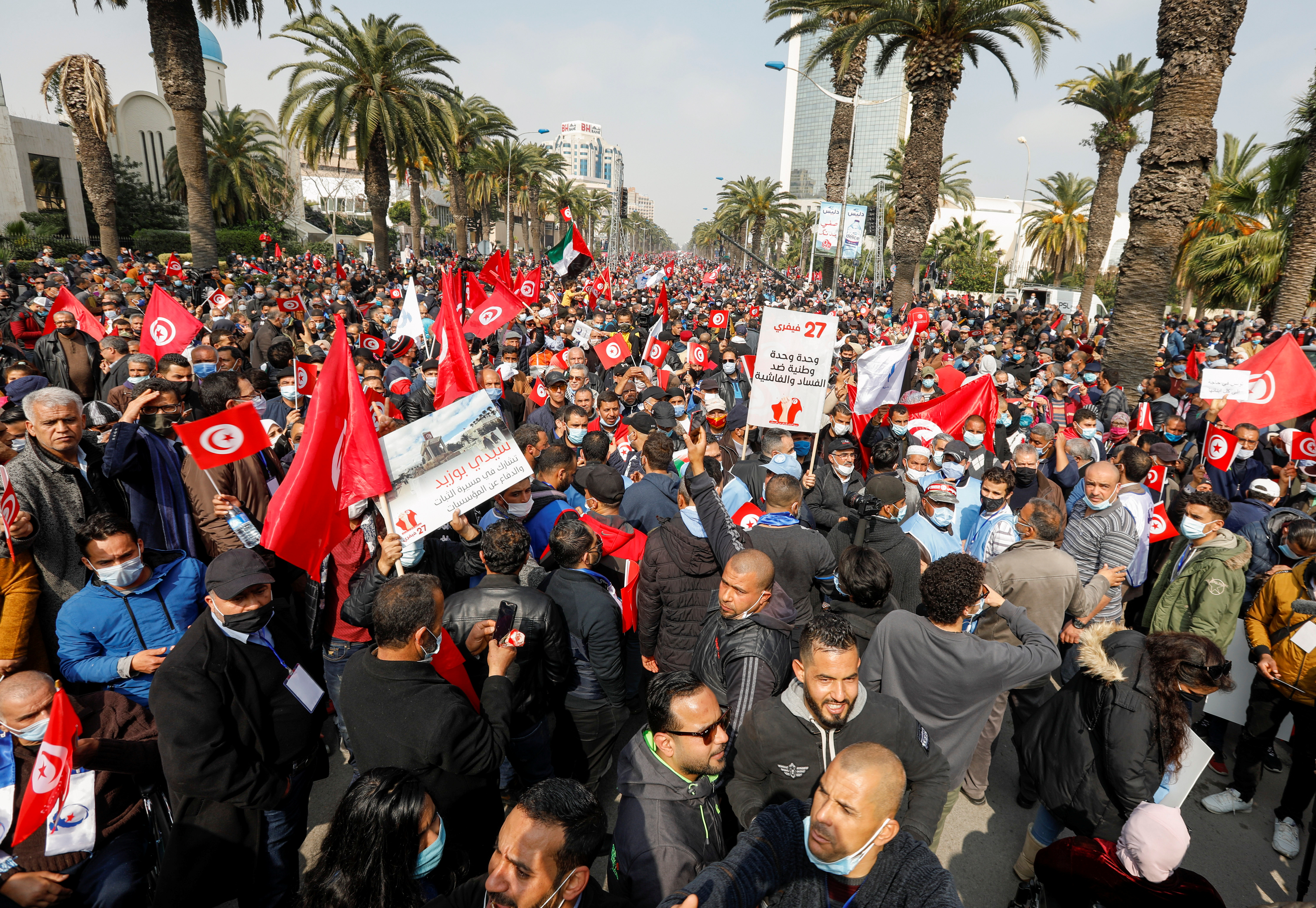 Supporters of Tunisia's biggest political party, the moderate Islamist Ennahda, march during a rally in opposition to President Kais Saied