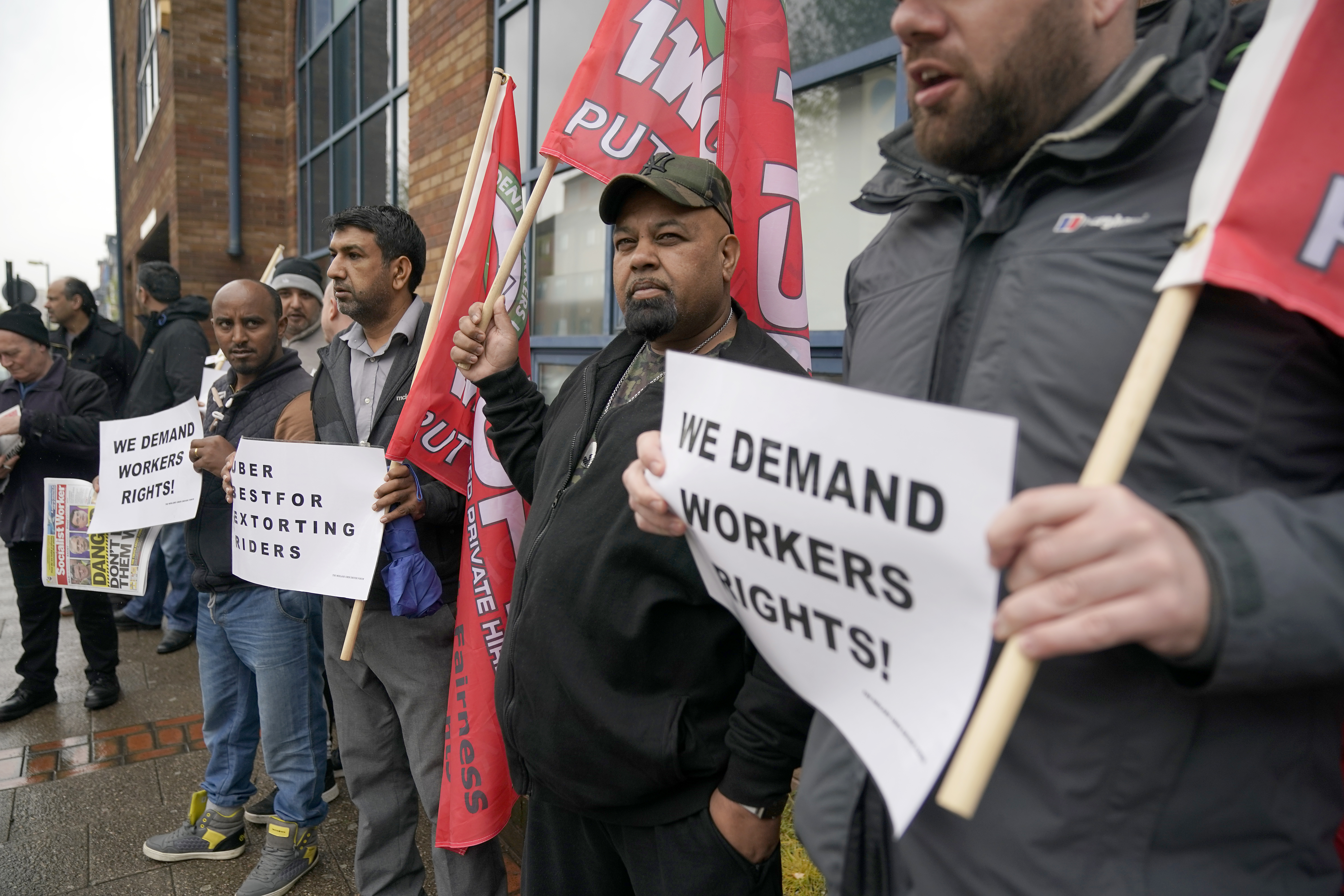 Uber drivers protest outside the Uber offices on May 8, 2019 in Birmingham, England [Photo by Christopher Furlong/Getty Images]