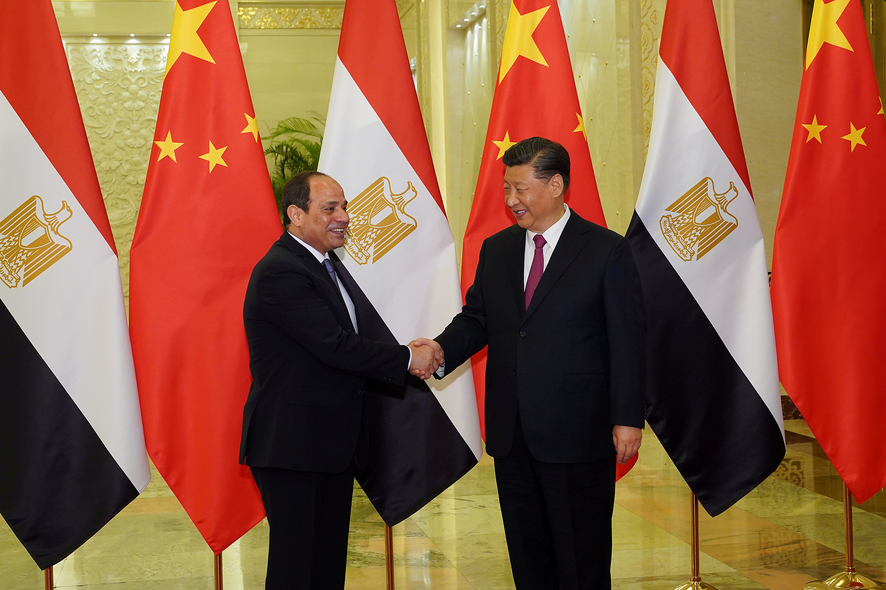 Chinese President Xi Jinping shakes hands with Egypt's President Abdel Fattah El-Sisi