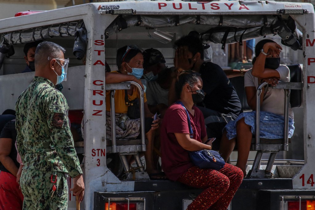 The Duterte government has responded to the pandemic in much the same way as it did to other national problems: a law-and-order crackdown with heavy policing [Jam Sta Rosa/AFP]