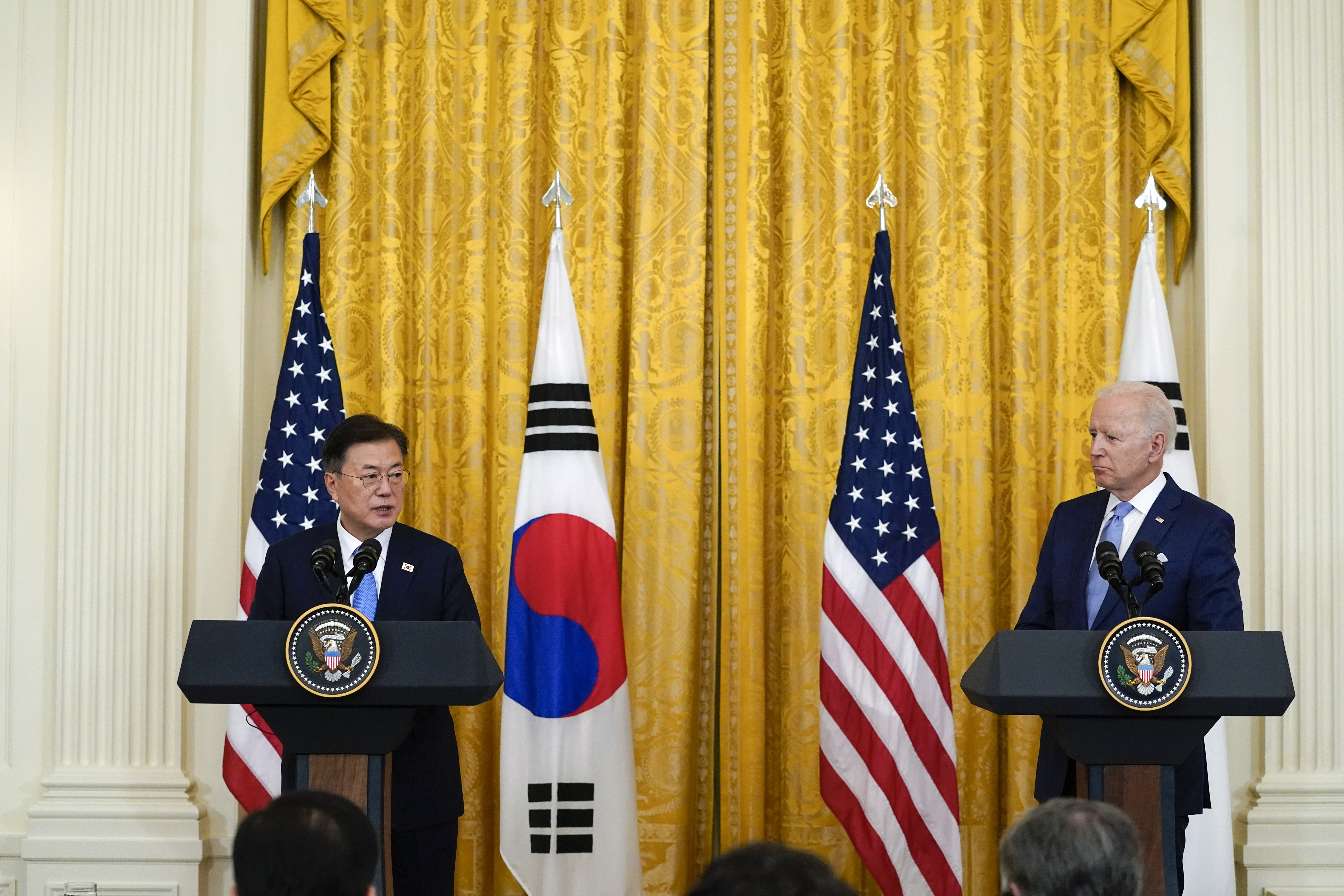 US President Joe Biden listens as South Korean President Moon Jae-in speaks during a joint news conference in the East Room of the White House, Friday, May 21, 2021, in Washington, DC [Alex Brandon/ AP]