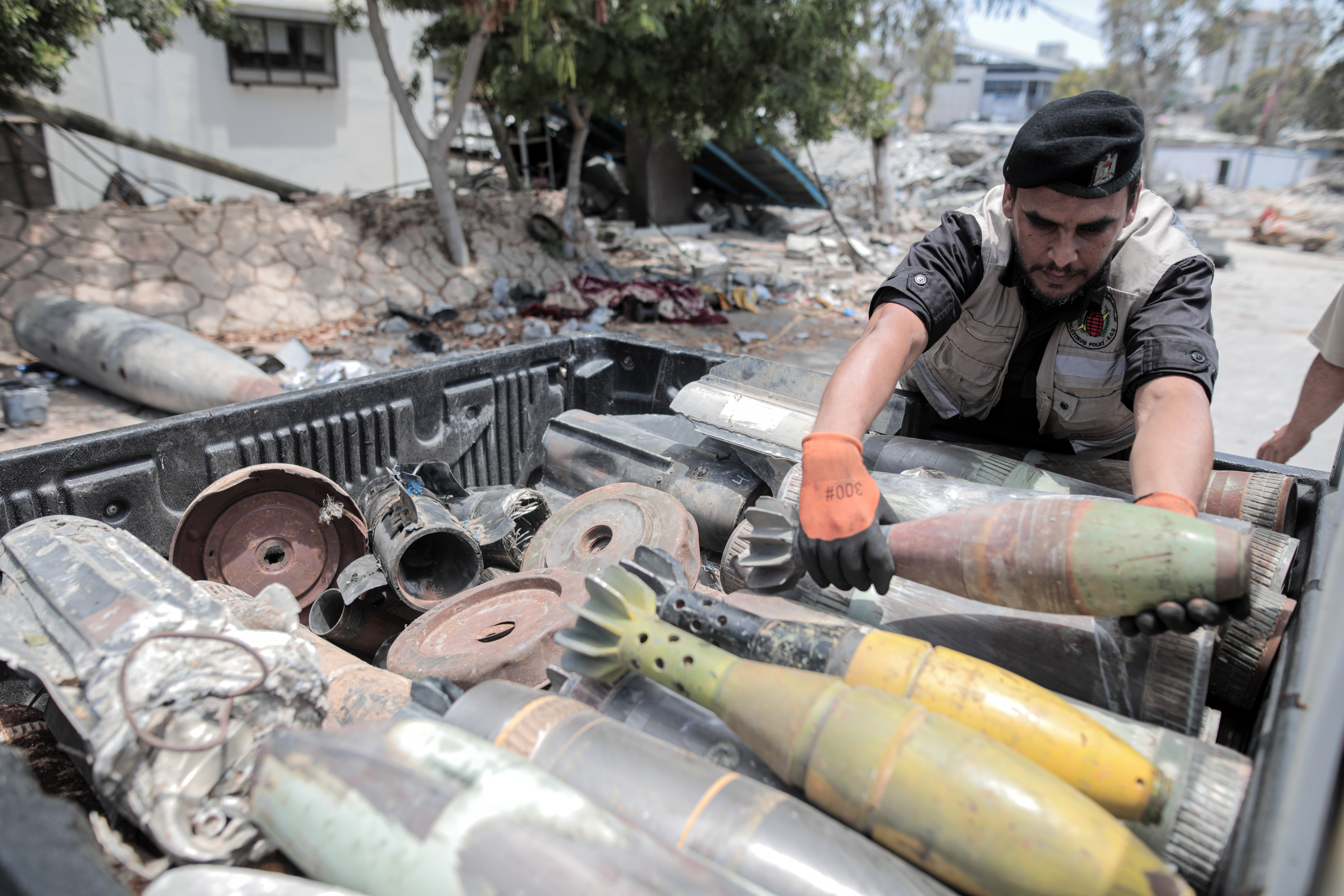 A member of the bomb disposal squad transports neutralised Israeli missiles away from residential areas [Hosam Salem/Al Jazeera]