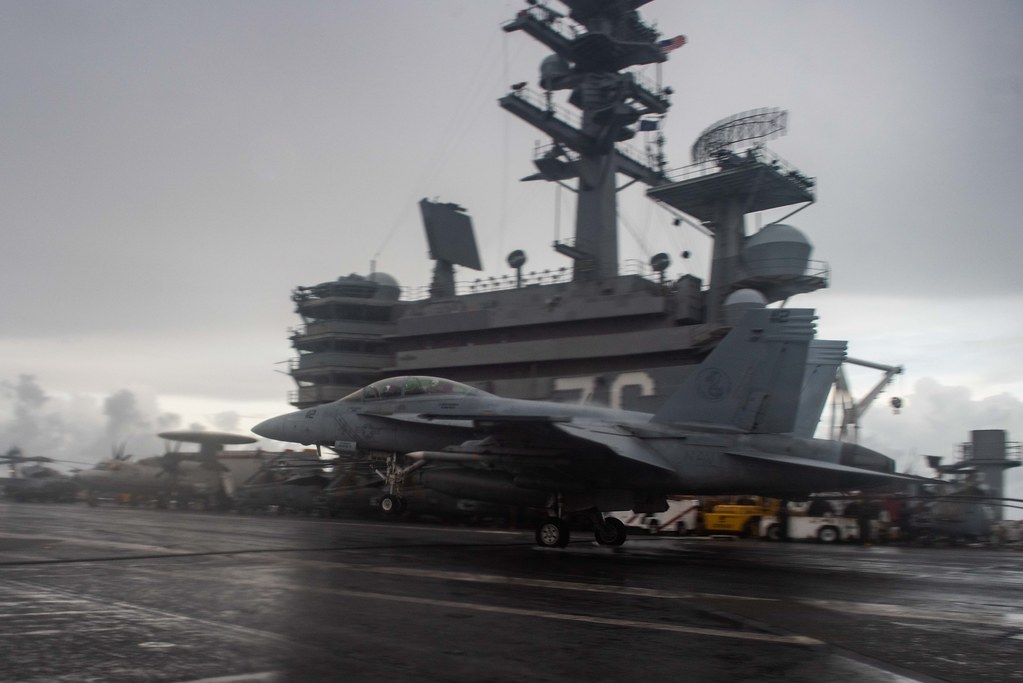 SOUTH CHINA SEA (June 14, 2021) An F/A-18F Super Hornet attached to the Diamondbacks of Strike Fighter Squadron (VFA) 102 lands on the flight deck of the U.S. Navy’s only forward-deployed aircraft carrier USS Ronald Reagan (CVN 76). Ronald Reagan, the flagship of Carrier Strike Group 5, provides a combat-ready force that protects and defends the United States, as well as the collective maritime interests of its allies and partners in the Indo-Pacific region. (U.S. Navy photo by Mass Communication Specialist 2nd Class Samantha Jetzer)