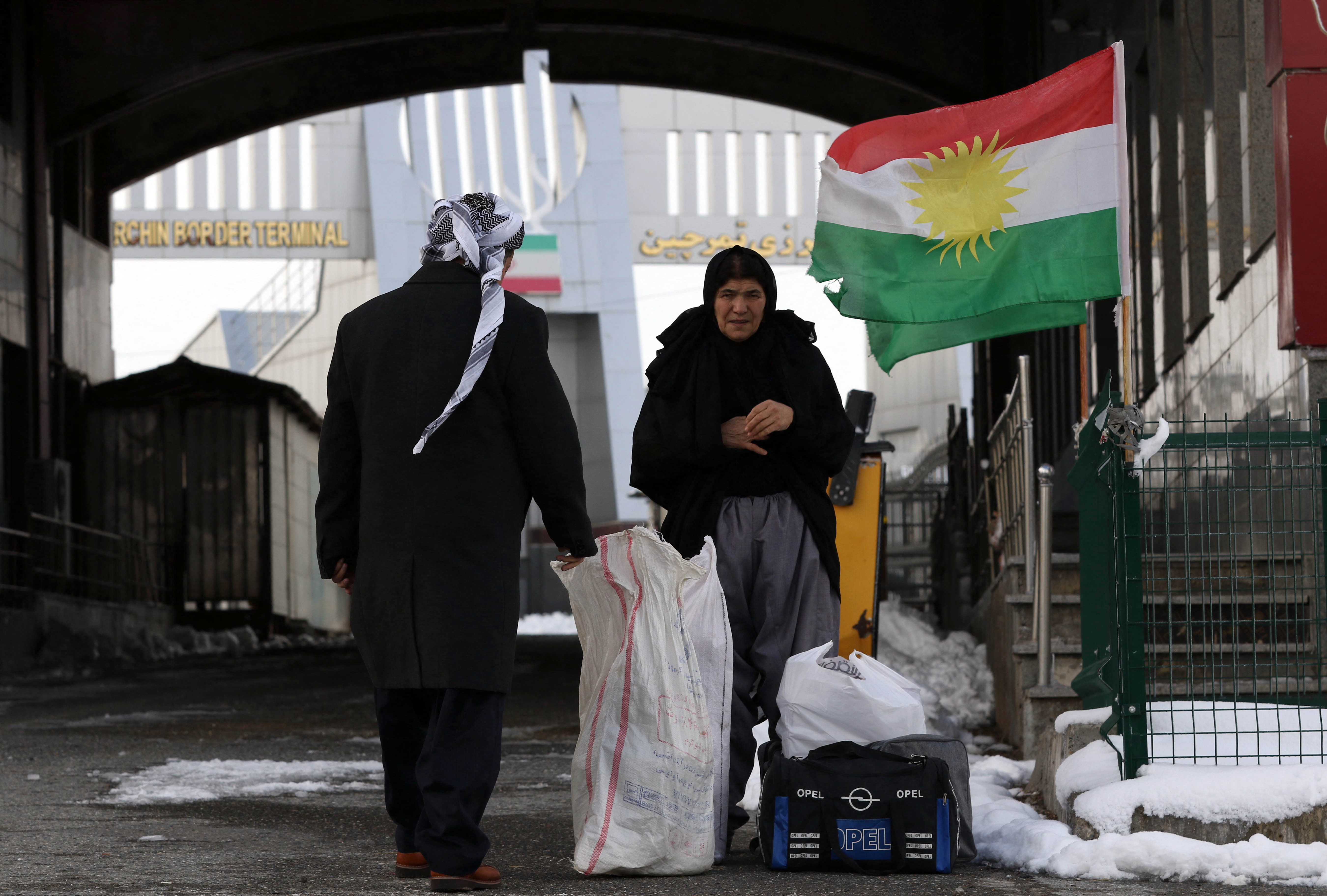 Iranian Kurds arrive at the Iran-Iraq border crossing of Haji Omran [File: Safin Hamed/AFP]