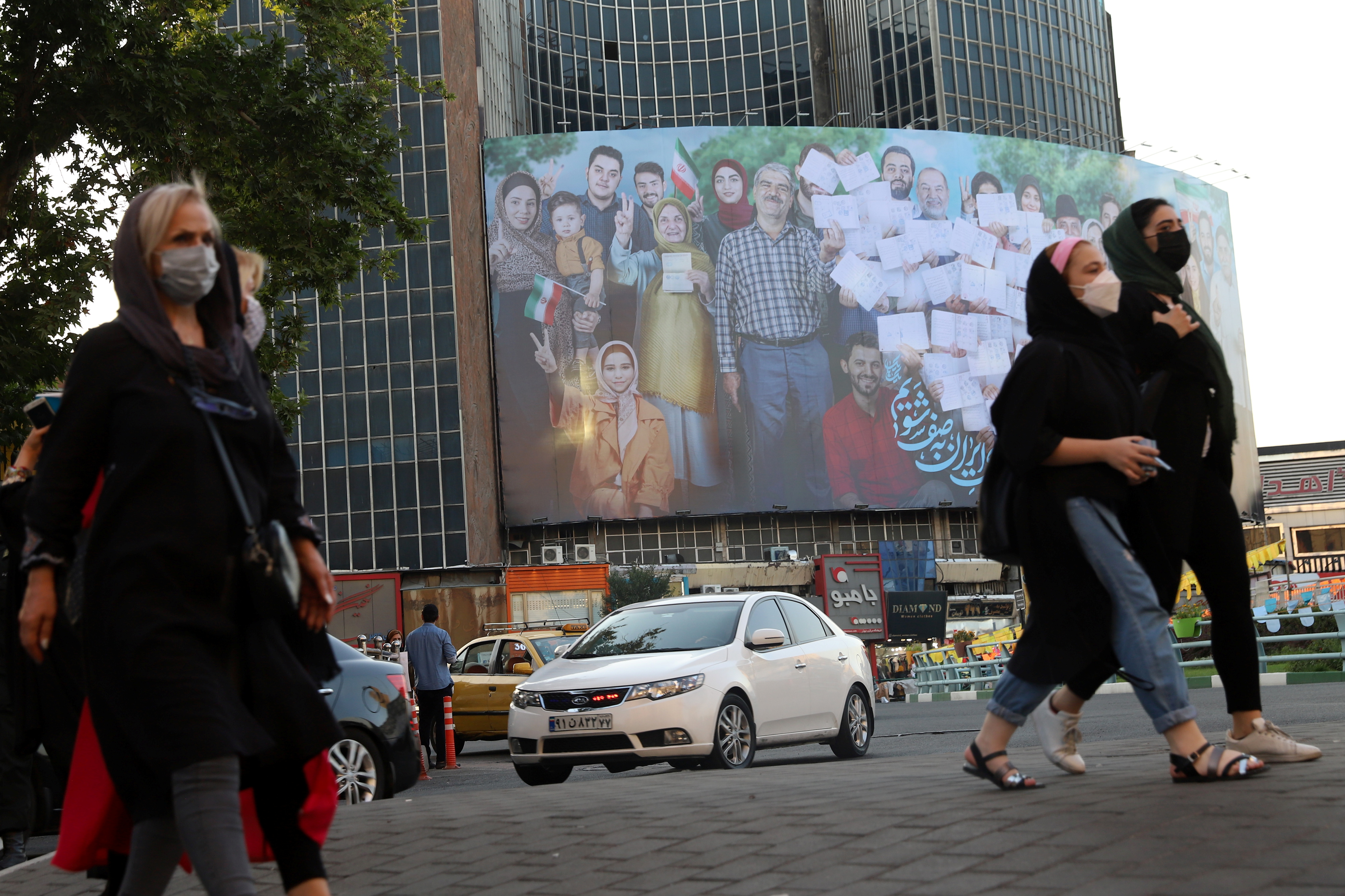 A banner of the presidential election is seen in Valiasr square in Tehran, Iran June 16, 2021. [Majid Asgaripour/WANA via Reuters]