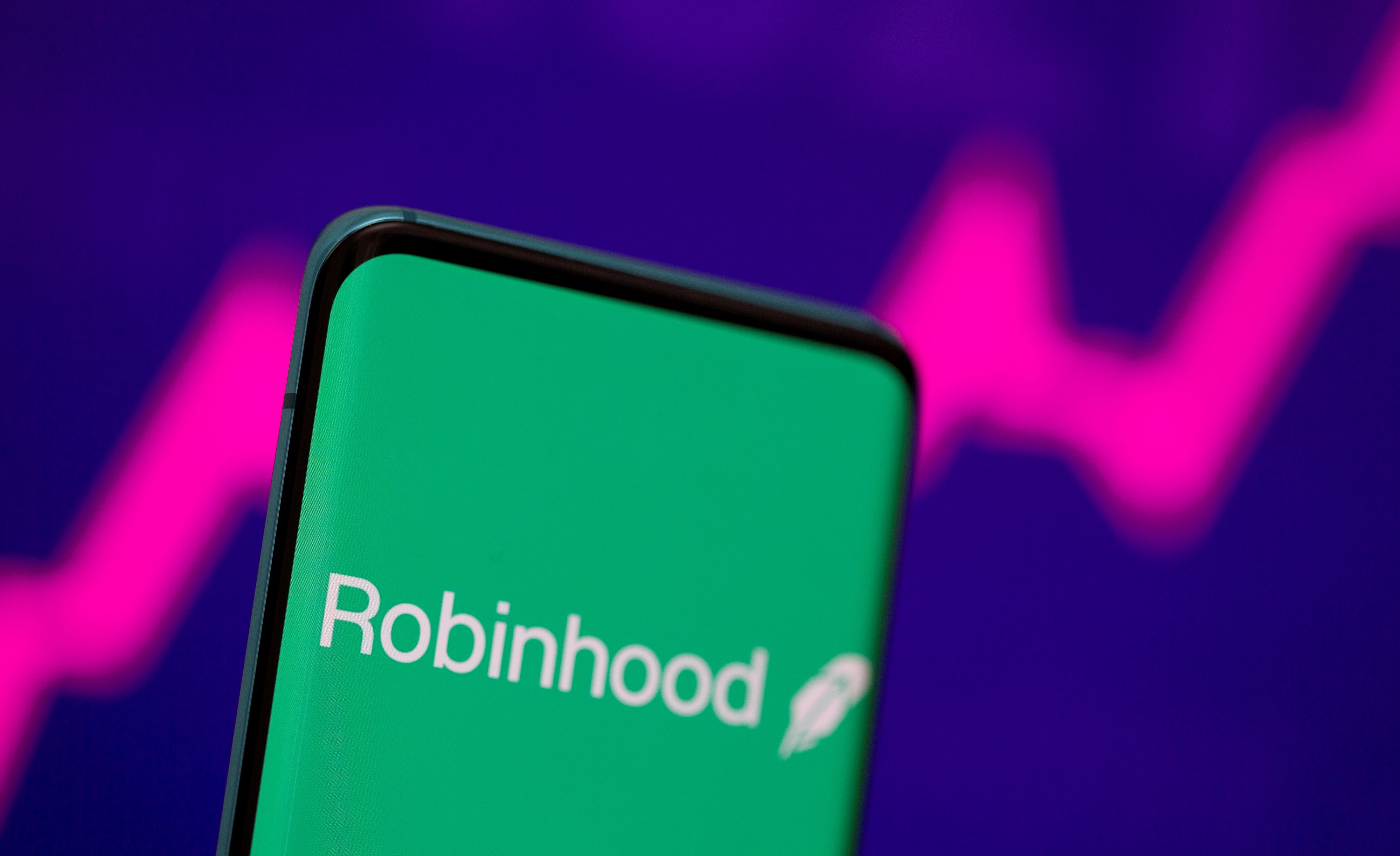 Investment app Robinhood's stated mission is to 'democratize finance for all', but critics dismiss the lofty ideal as spin [File: Dado Ruvic/Reuters]