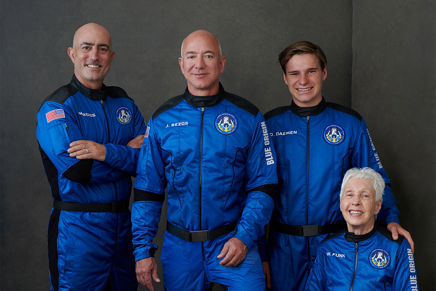 Amazon.com and Blue Origin founder Jeff Bezos (centre), his brother, Mark Bezos (left), Oliver Daemen (right) and Wally Funk (seated) experienced about three minutes of weightlessness during their first space flight on Tuesday [File: Blue Origin via AP]
