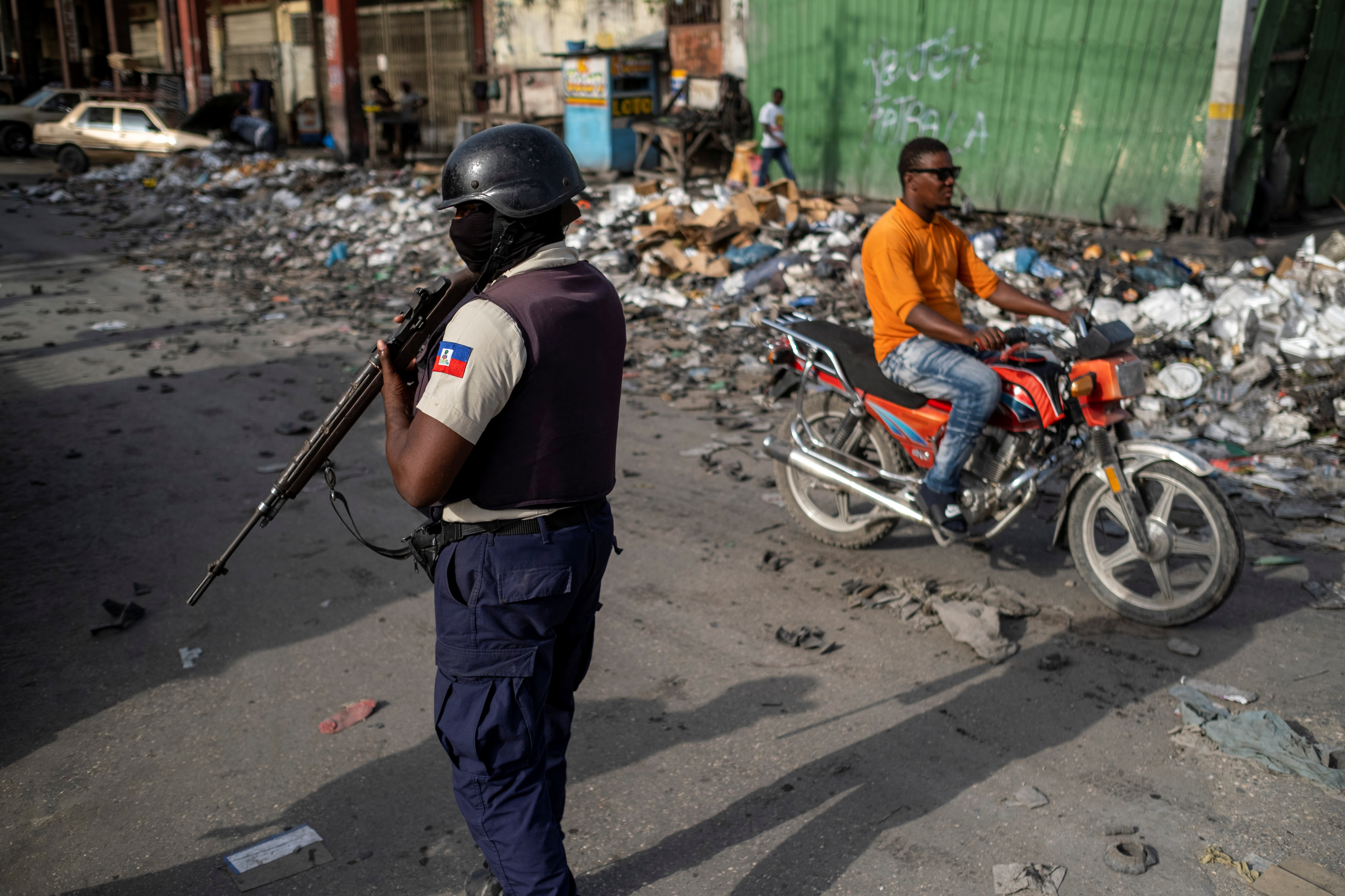 Haitian Police guard a street after the appointment ceremony of Ariel Henry as prime minister in Port-au-Prince, Haiti on July 20 [File: Ricardo Arduengo/Reuters]
