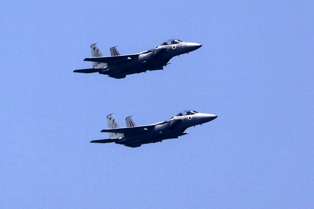 Israeli F-15 fighter jets perform over the Mediterranean coastal city of Tel Aviv, Israel.