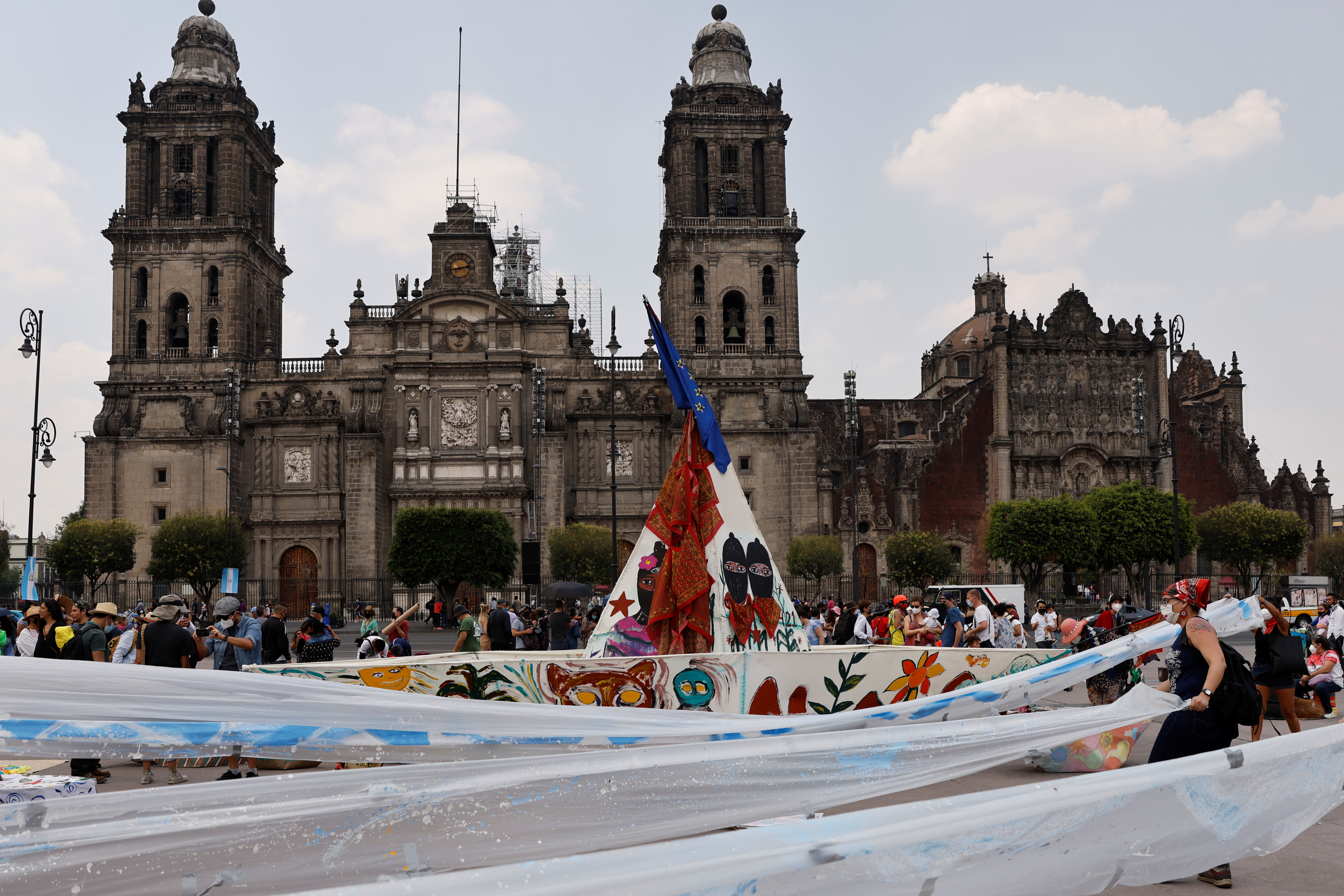 A paper boat is displayed during a cultural event by artists and activists, as well-wishes for the delegation of the National Liberation Zapatista Army travelling on a boat called 'La Montana' to Europe, in Mexico City, Mexico, May 2, 2021 [File: Carlos Jasso/Reuters]