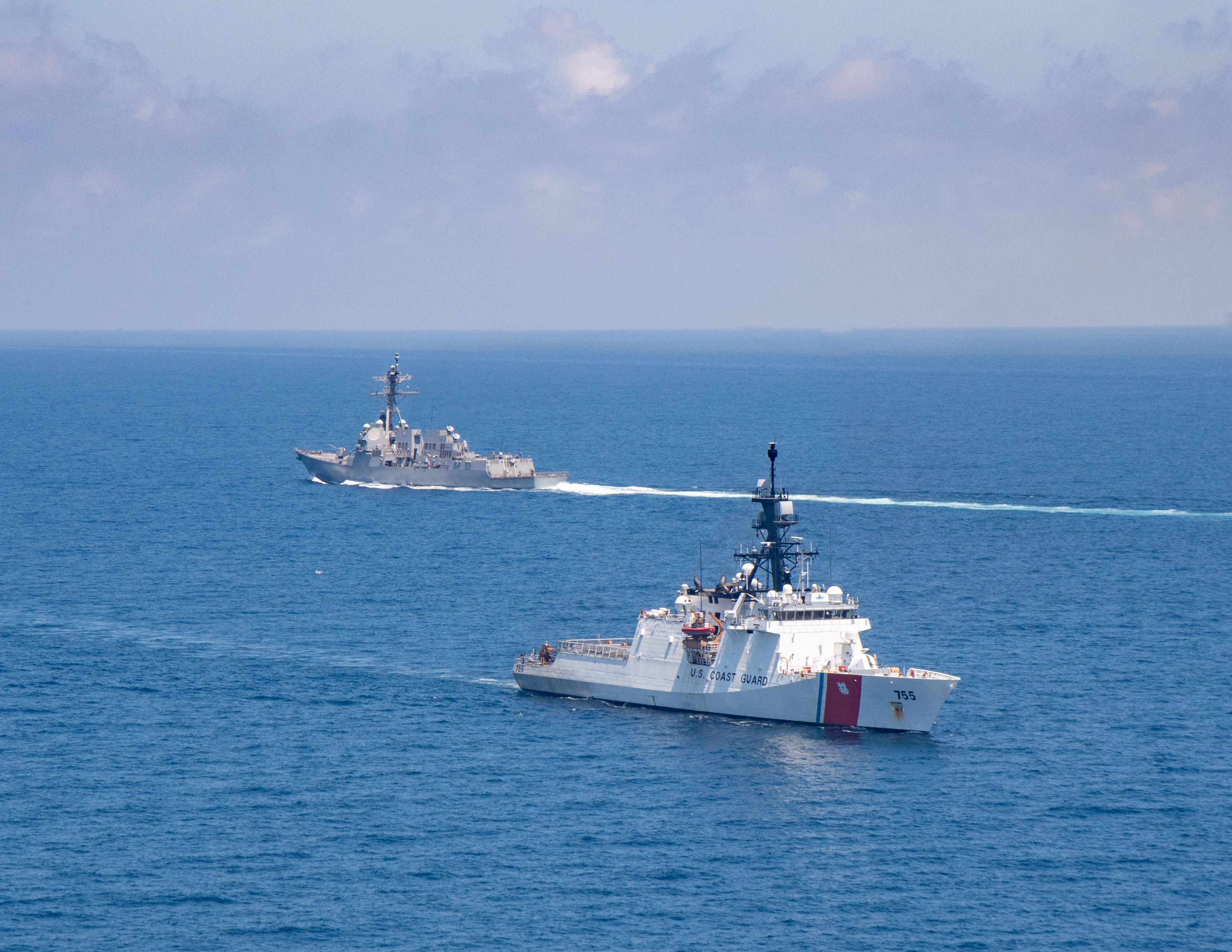 The Arleigh Burke-class guided-missile destroyer USS Kidd and U.S. Coast Guard cutter Munro conduct Taiwan Strait transits August 27, 2021. Picture taken August 27, 2021. U.S. Navy/Handout via REUTERS THIS IMAGE HAS BEEN SUPPLIED BY A THIRD PARTY.