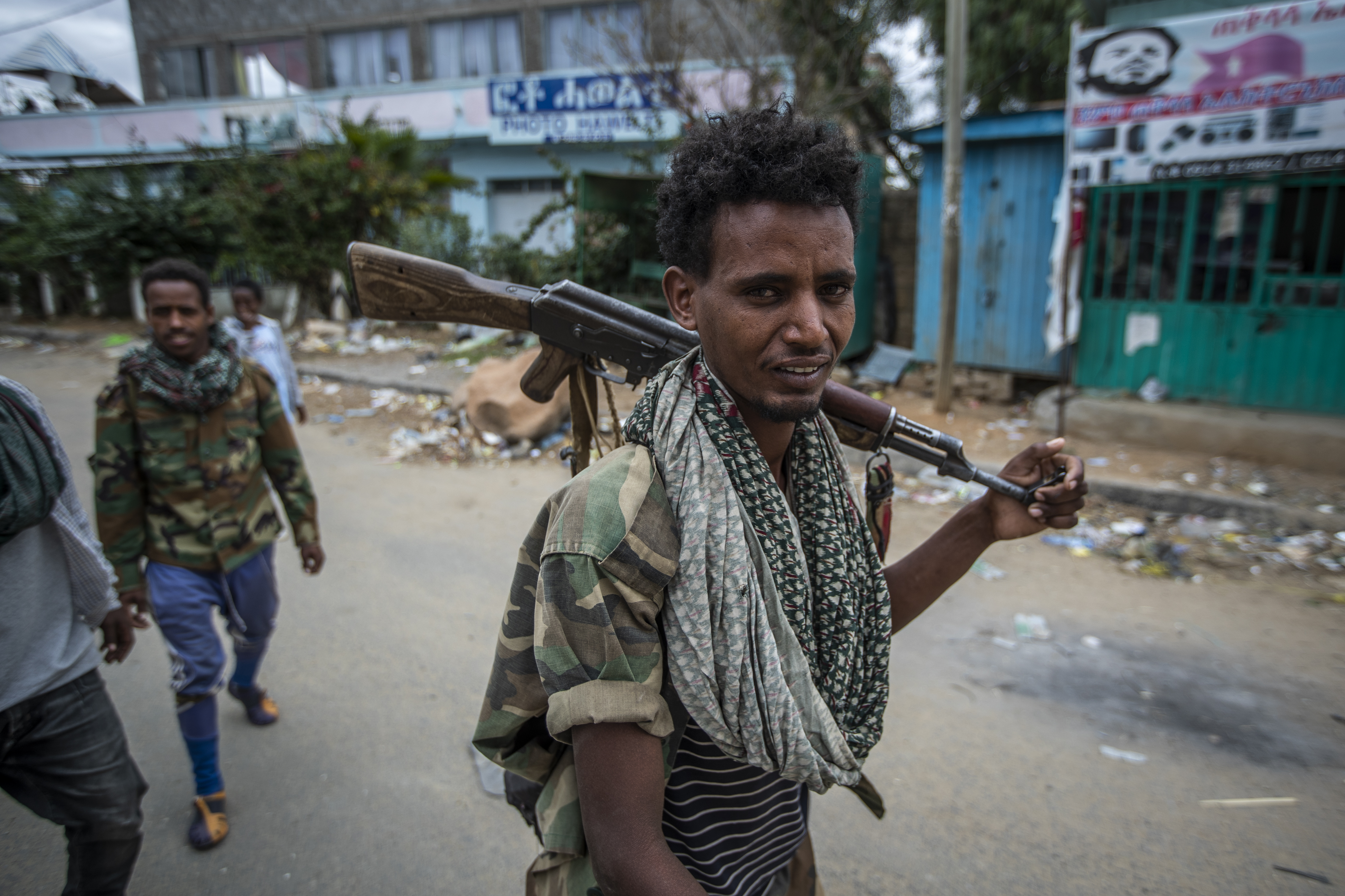 In this Friday, May 7, 2021 file photo, fighters loyal to the Tigray People's Liberation Front (TPLF) walk along a street in the town of Hawzen, then-controlled by the group, in the Tigray region of northern Ethiopia [Ben Curtis, AP]