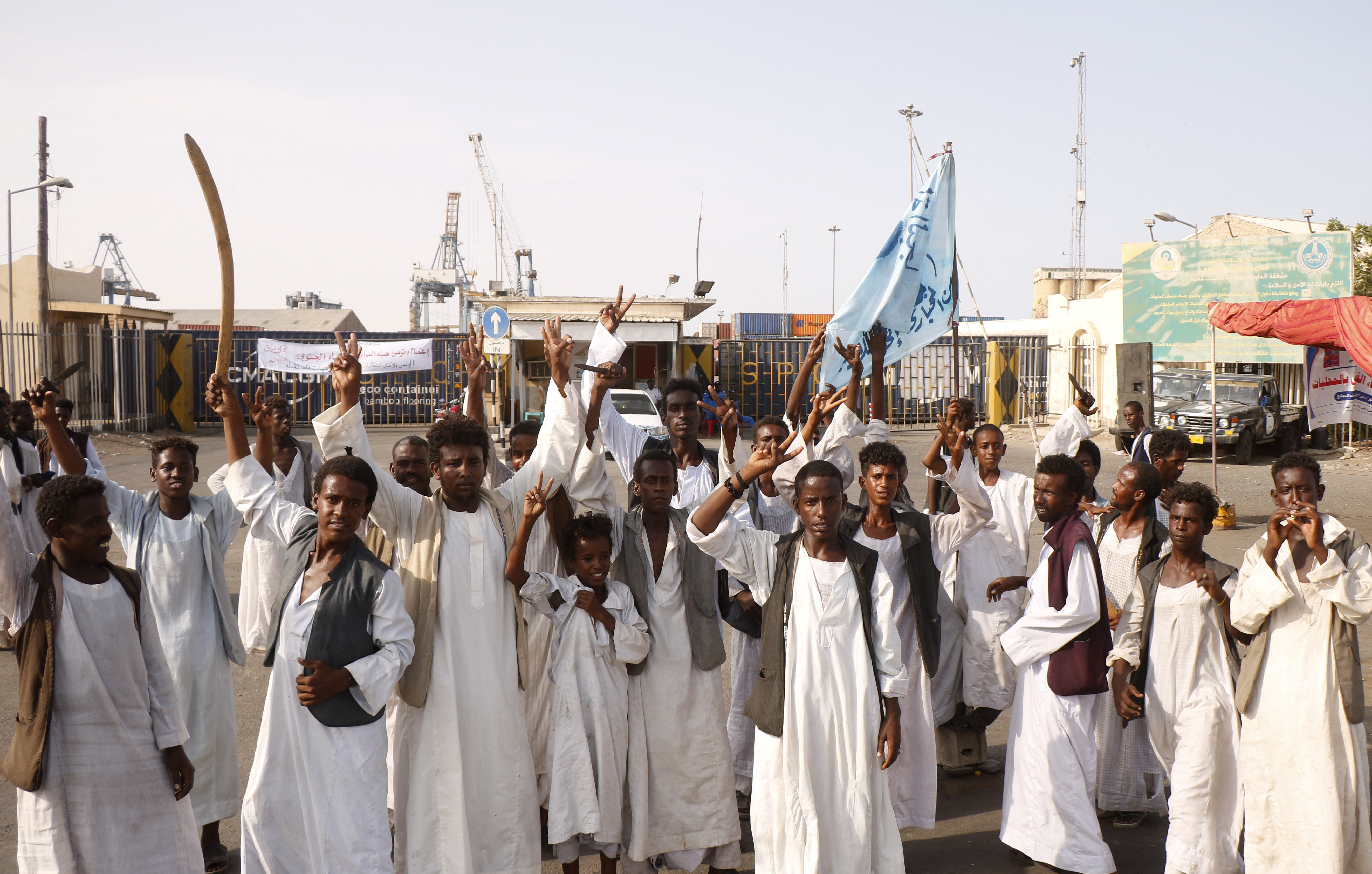 Sudanese protesters gather outside the main entrance to the southern port in Port Sudan [File: Ibrahim Ishaq/AFP]