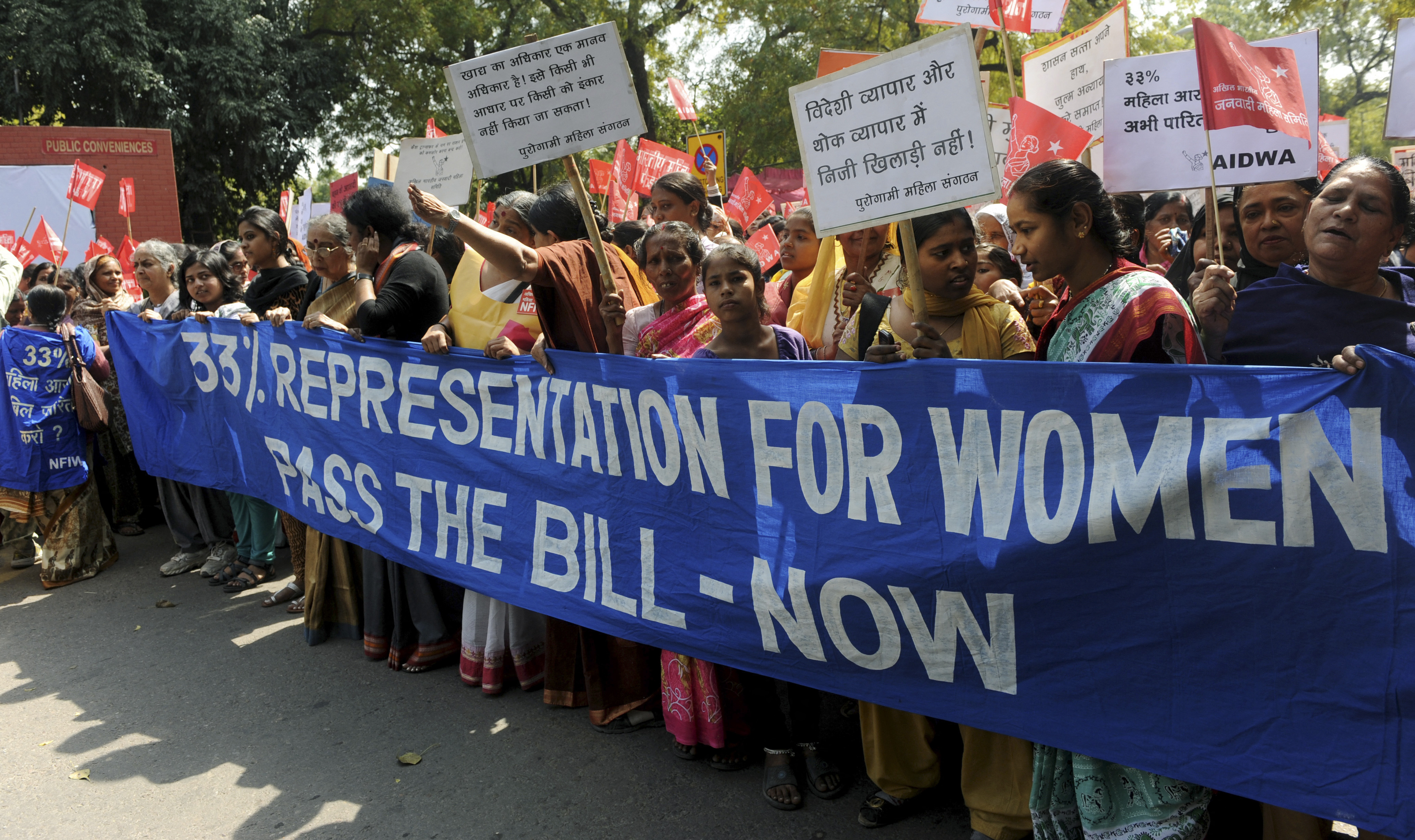 Activists from All India Democratic Women's Association (AIDWA) shout slogans demanding the passing of the Women's Reservation Bill near parliament house in 2011 in New Delhi [File: Raveendran/AFP]