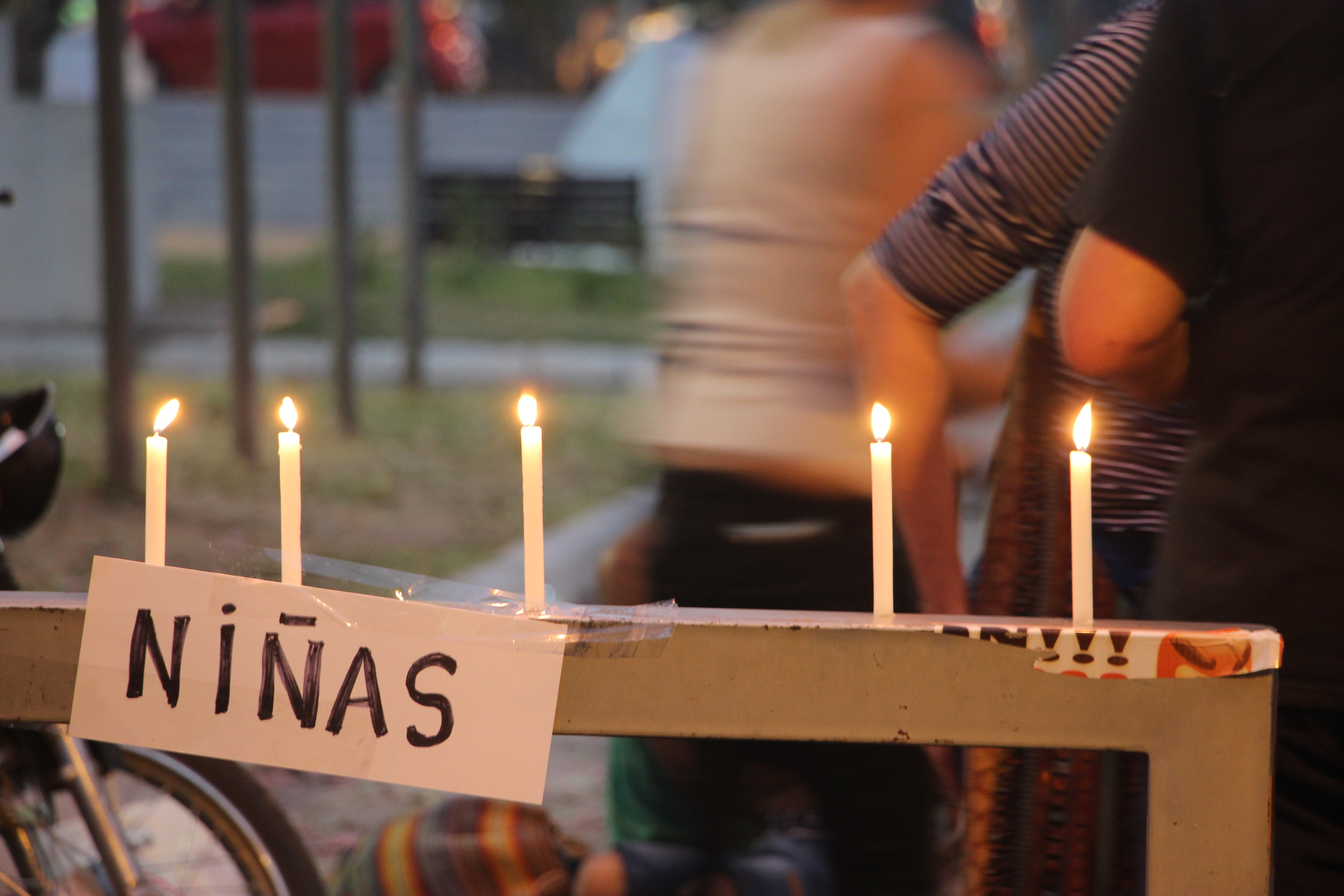 A sign reading 'girls' is seen during a protest over the deaths of María del Carmen Villalba and Liliana Villalba in September 2020 [William Costa/Al Jazeera]