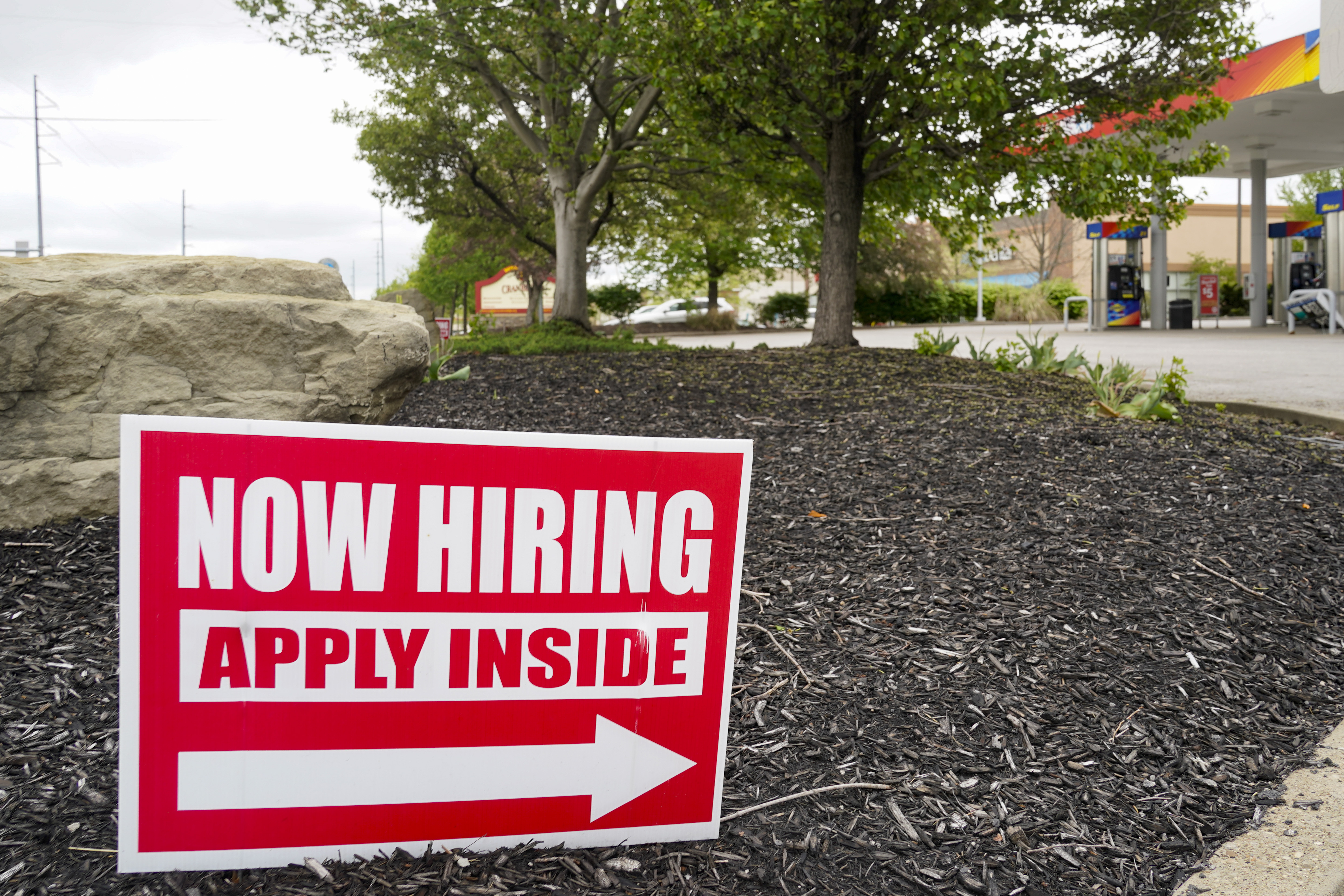 Hiring signs are posted outside a gas station in Cranberry Township, Butler County, Pa.