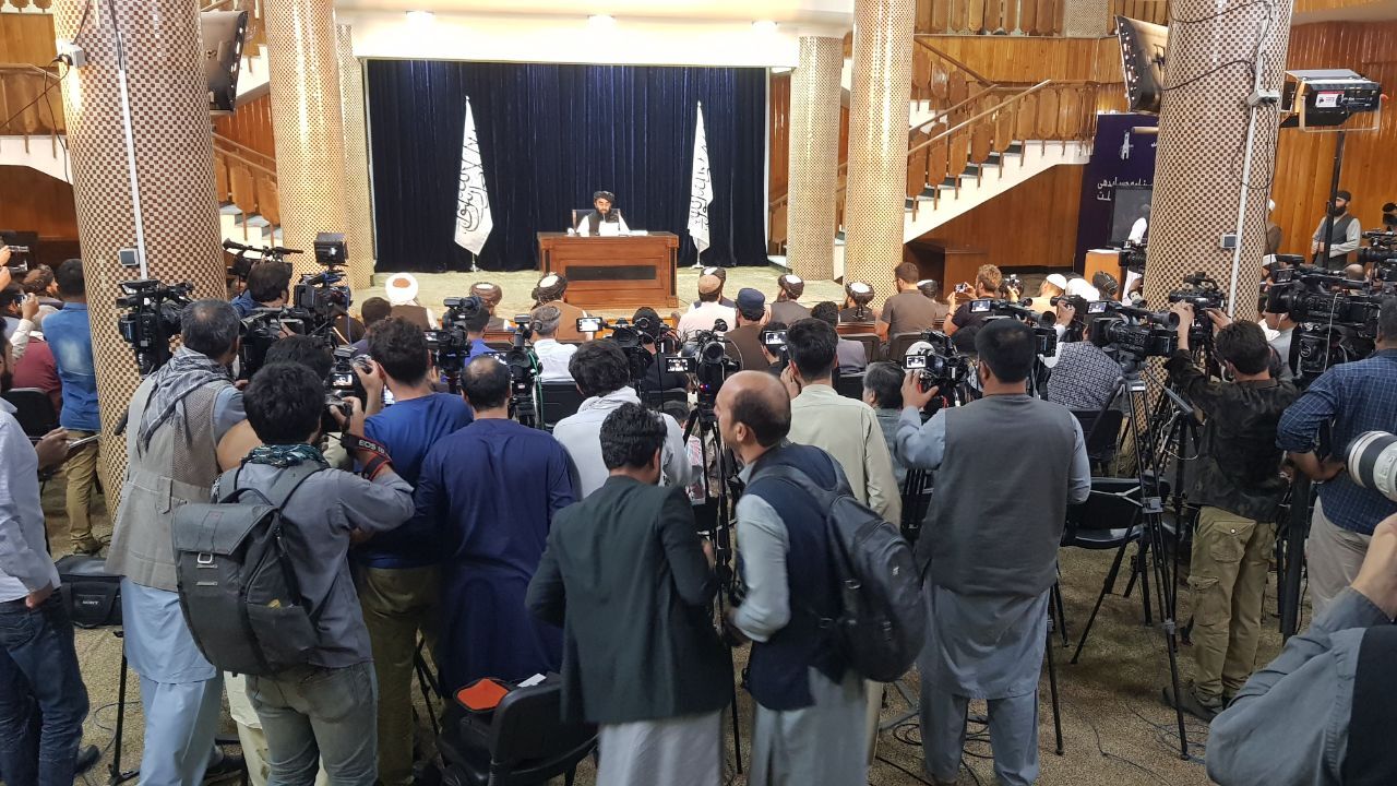 Media and Taliban officials are seen as Taliban spokesperson Zabihullah Mujahid holds a press conference in Kabul, Afghanistan on September 07, 2021 to announce the formation of a caretaker government [Sayed Khodaiberdi Sadat/Anadolu Agency via Getty Images]