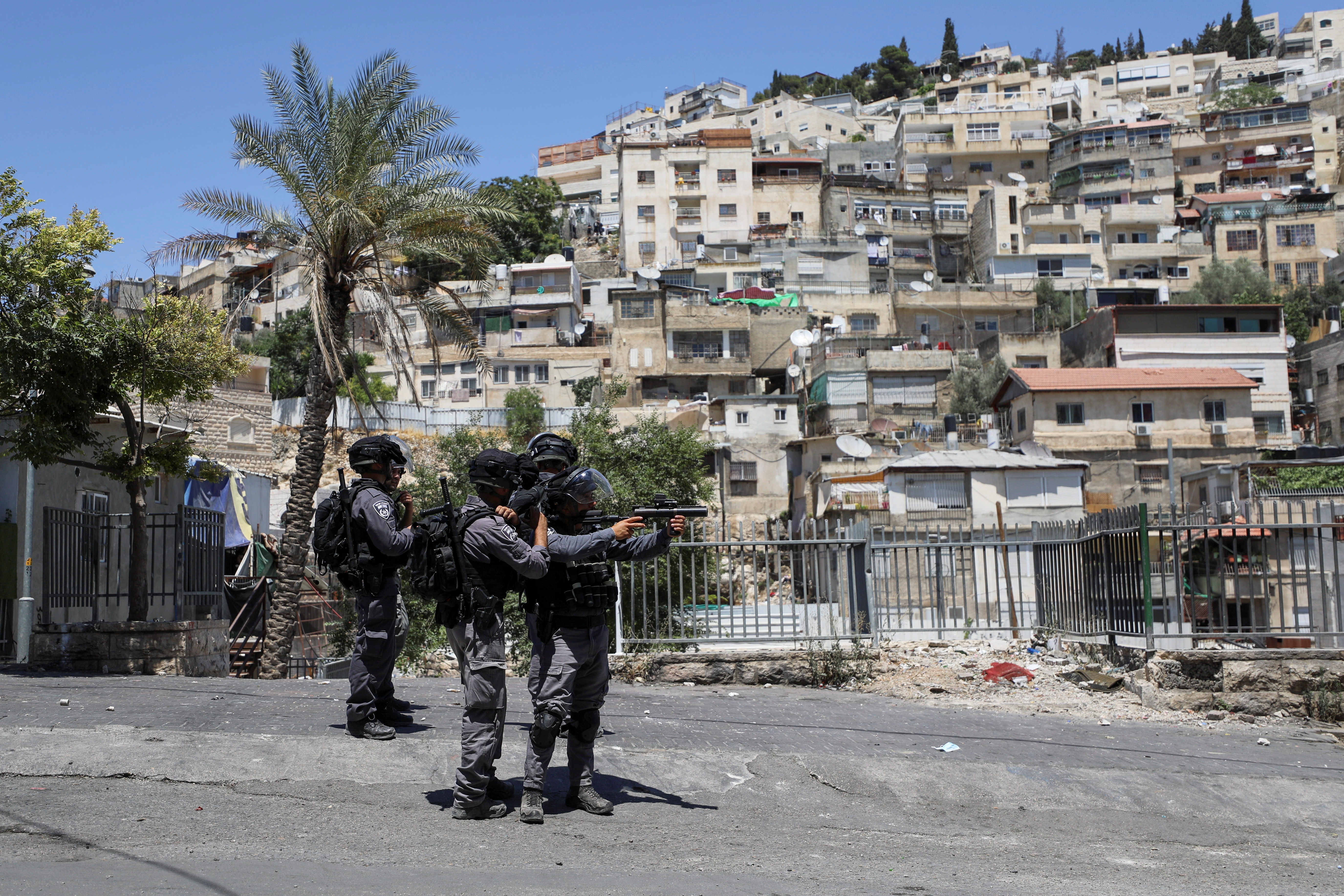 An Israeli security force member aims his weapon