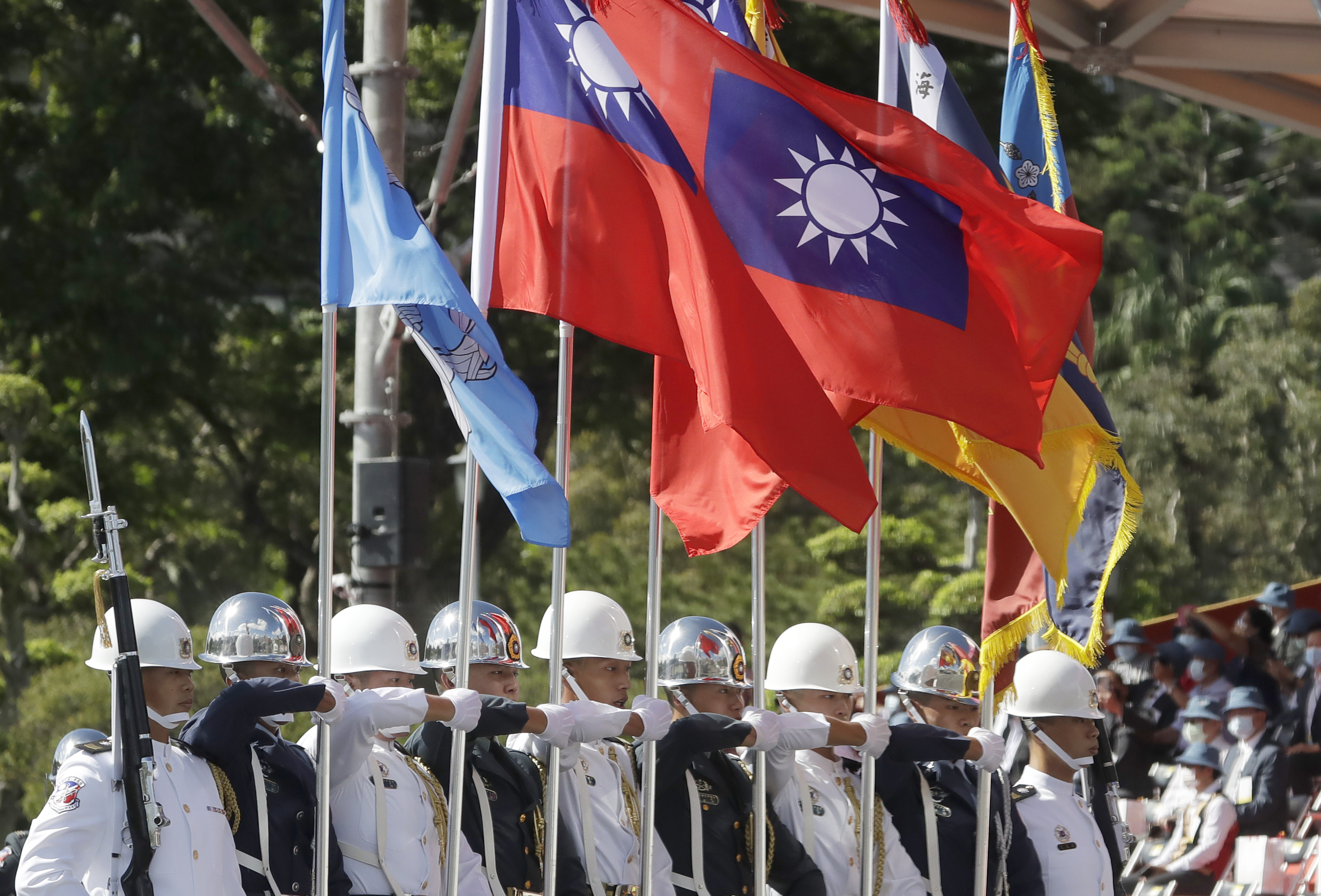 The military honour guard attend during National Day celebrations in front of the Presidential Building in Taipei, Taiwan, on Sunday, October 10, 2021