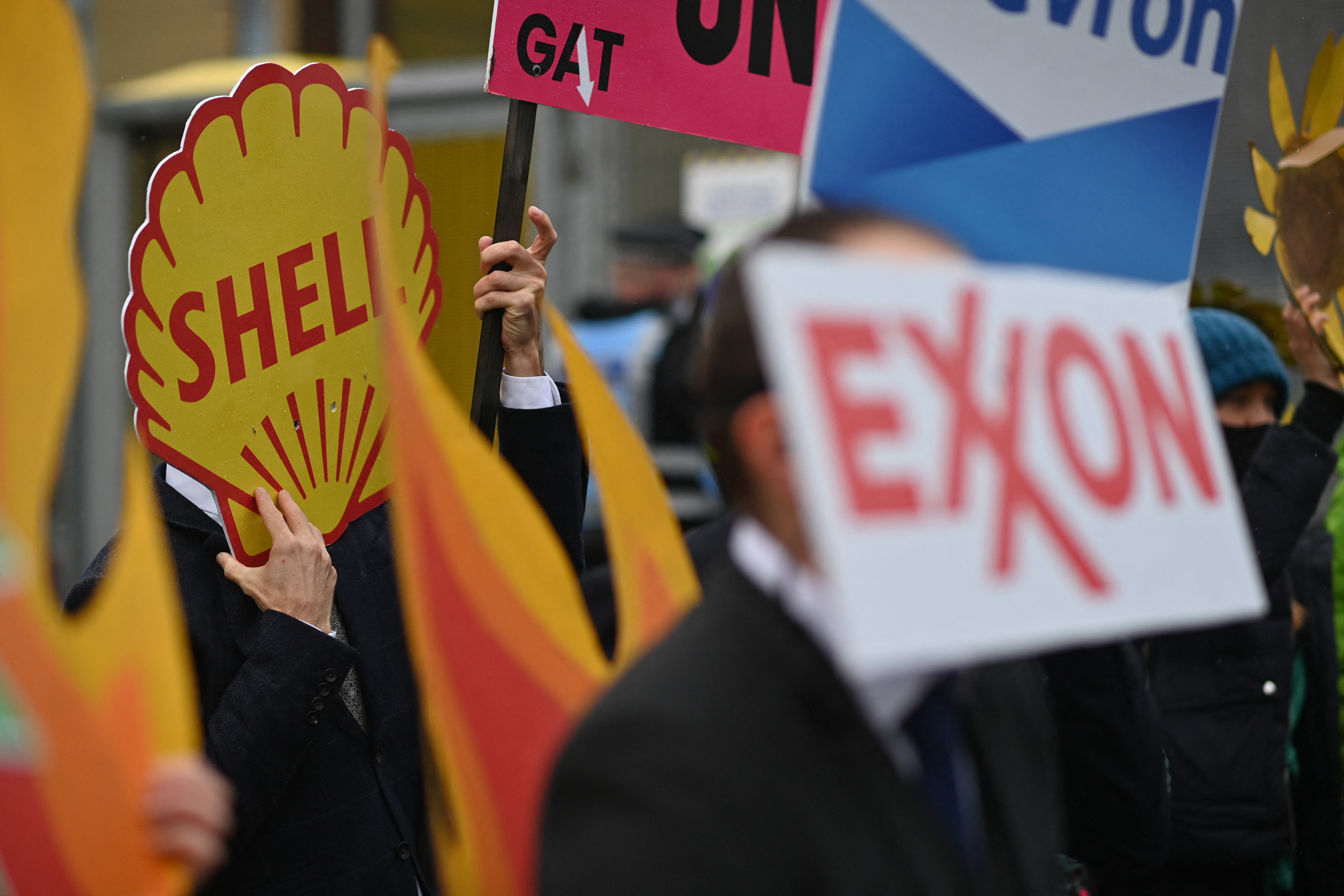 Climate activists carry placards in a protest in Britain