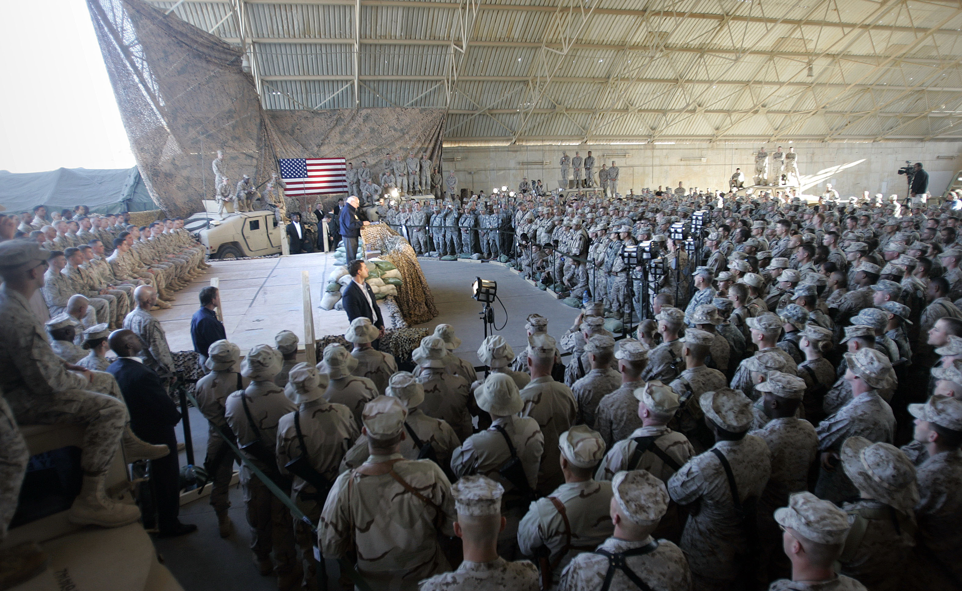 Then US Vice President Dick Cheney addresses Marines at Al-Asad Air Base in Iraq December 18, 2005. [Lawrence Jackson/Reuters]