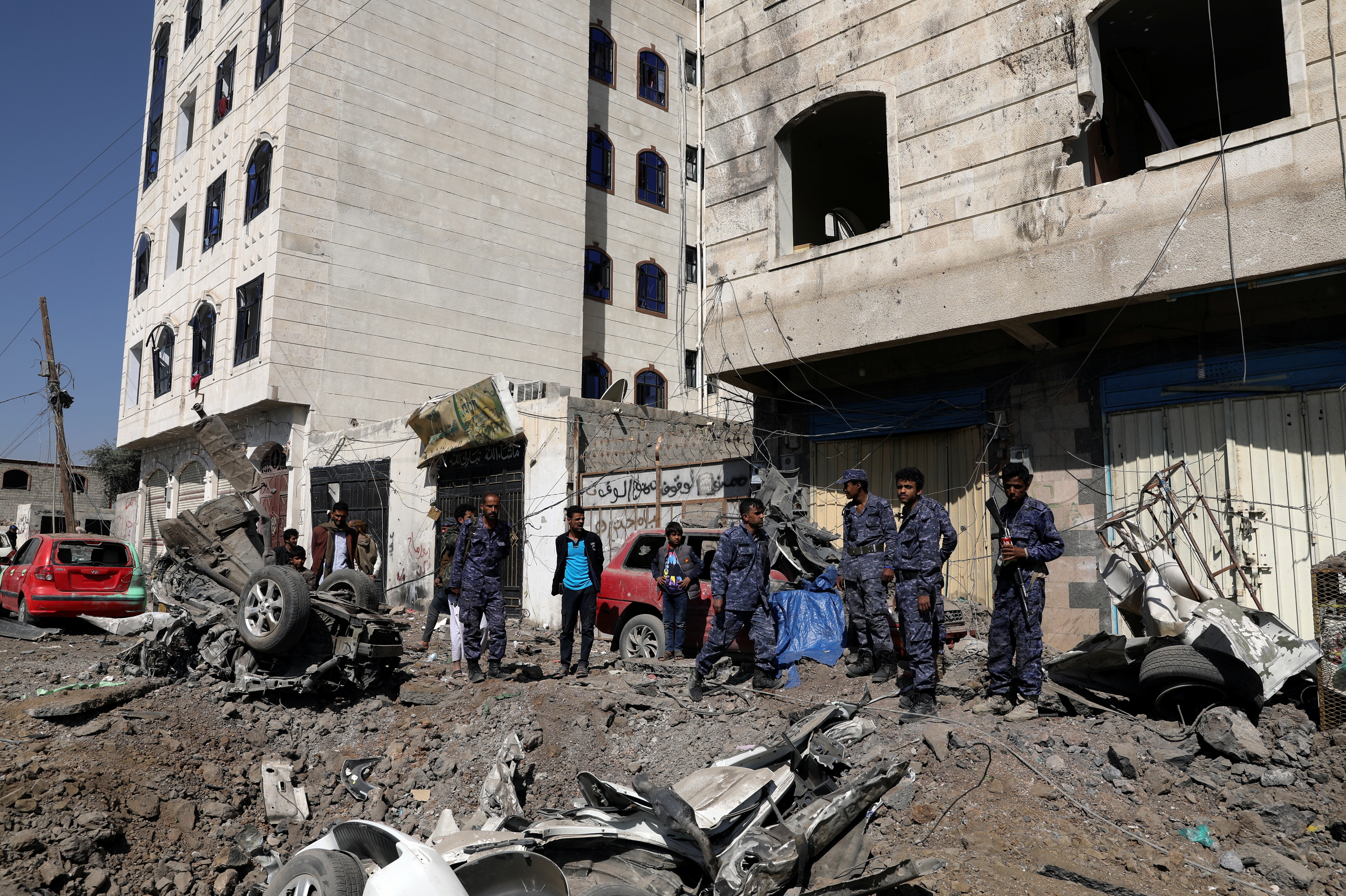 Police troopers stand at the scene of a Saudi-led air strike in Sanaa, Yemen November 11, 2021. REUTERS/Khaled Abdullah