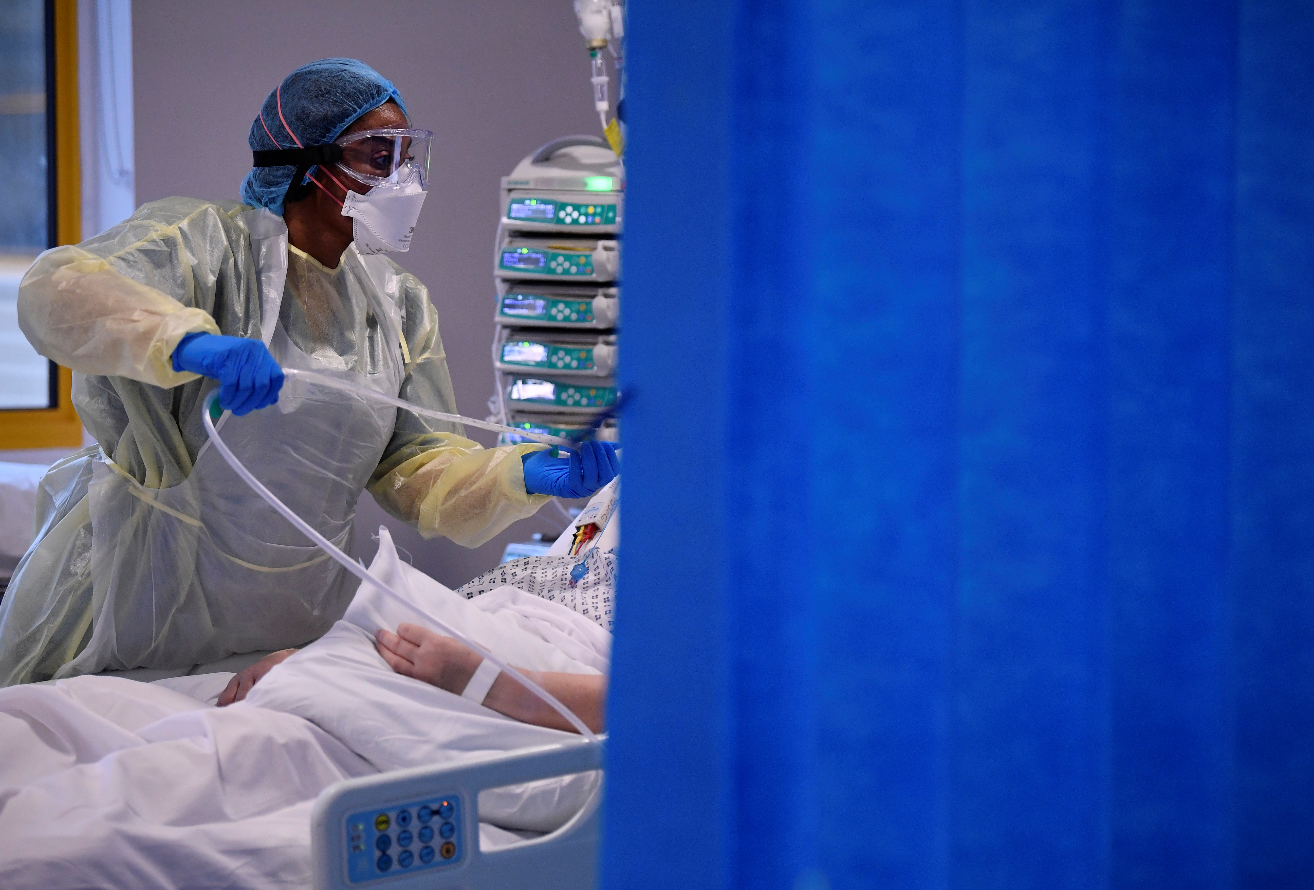 A COVID-19 patient receives treatment in the Intensive Care Unit at the Milton Keynes University Hospital, England