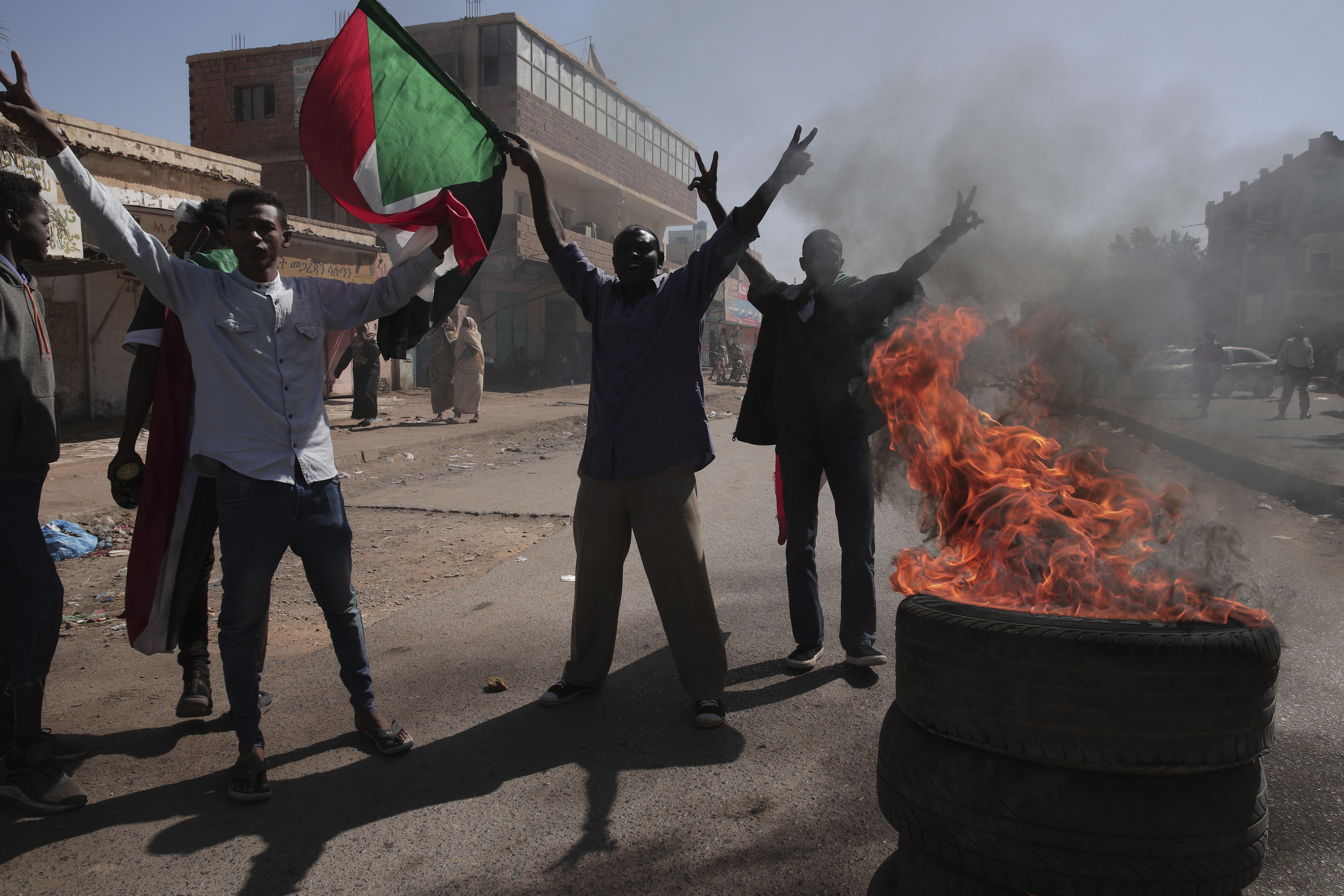 People chant slogans during a protest to denounce the October military coup, in Khartoum, Sudan