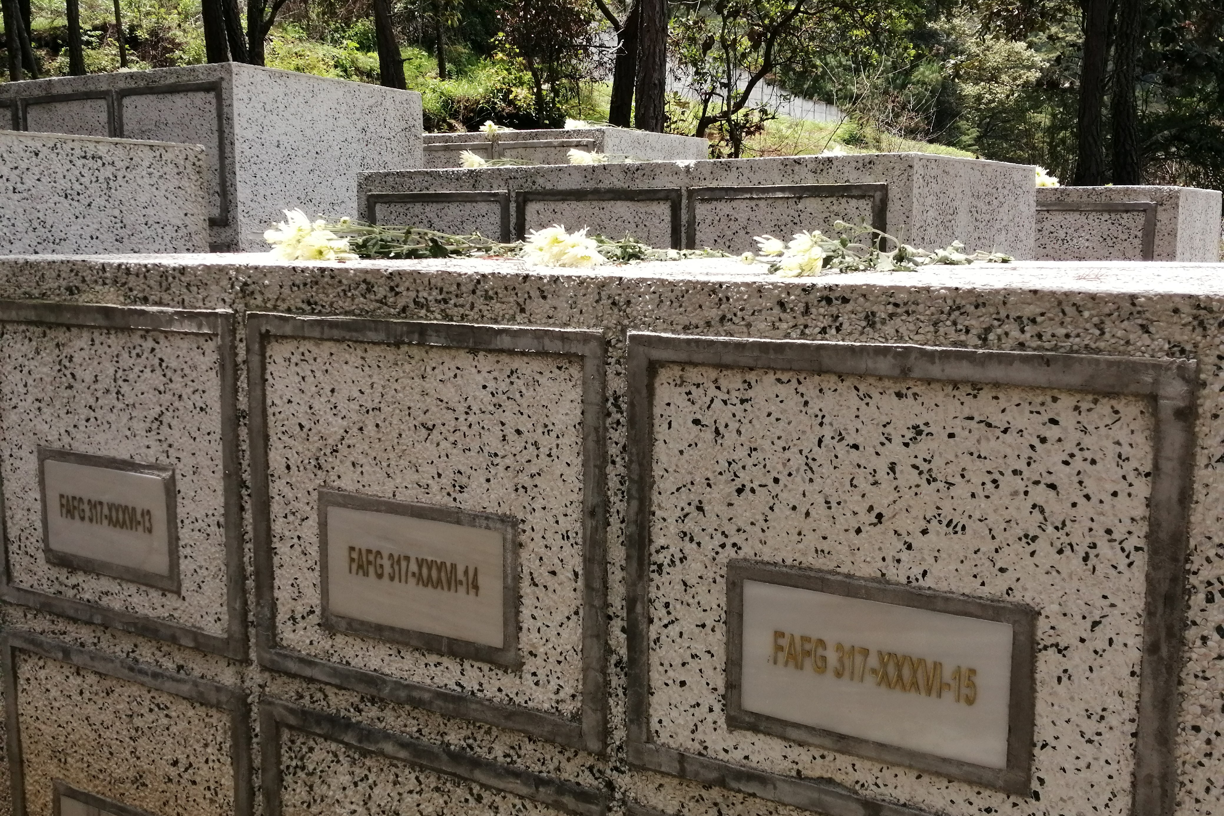 A mural on the grounds of a former military base in San Juan Comalapa depicts atrocities during the civil war