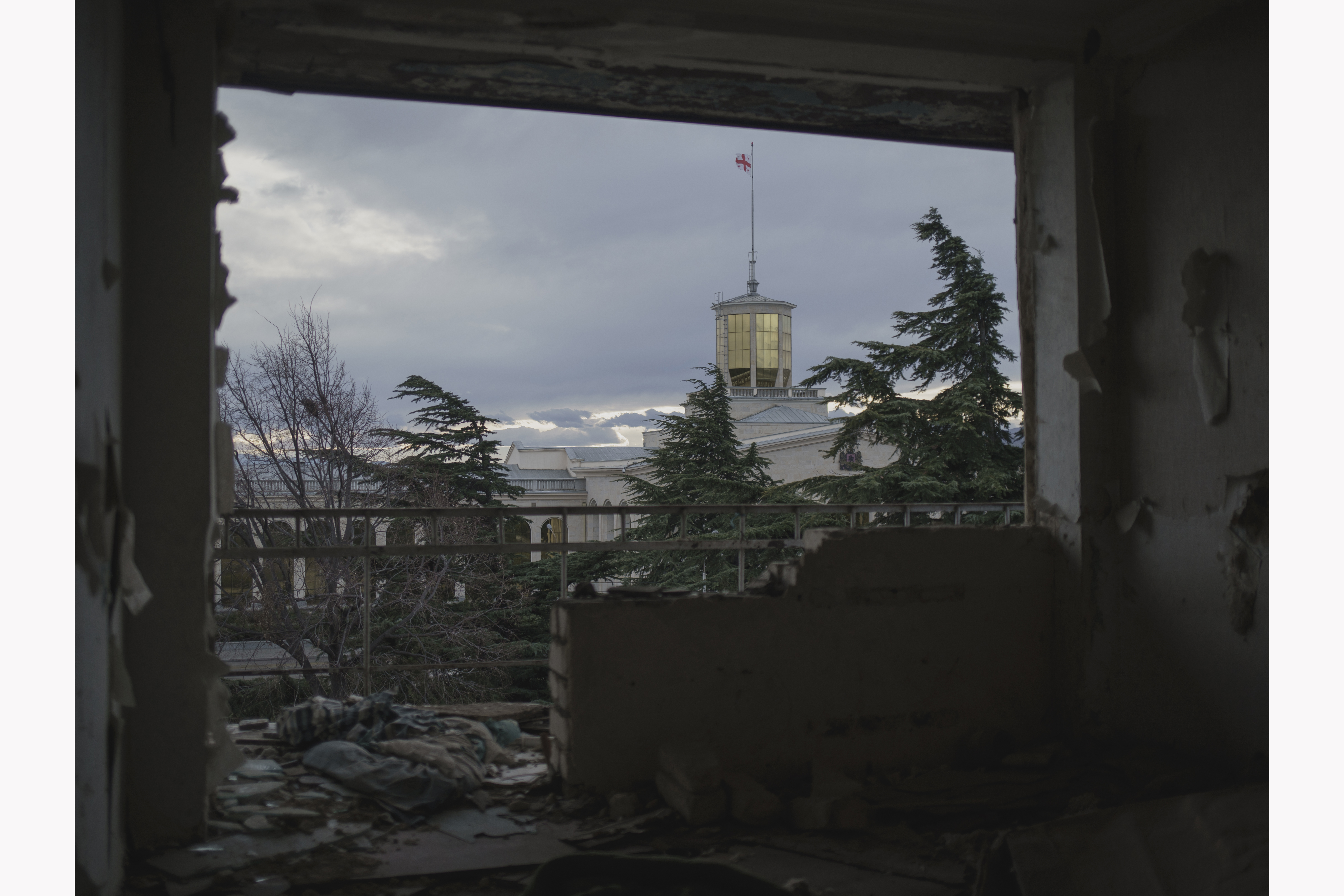The departure hall of Tbilisi airport from the Soviet period is photographed from a former hotel where refugees from Abkhazia now live