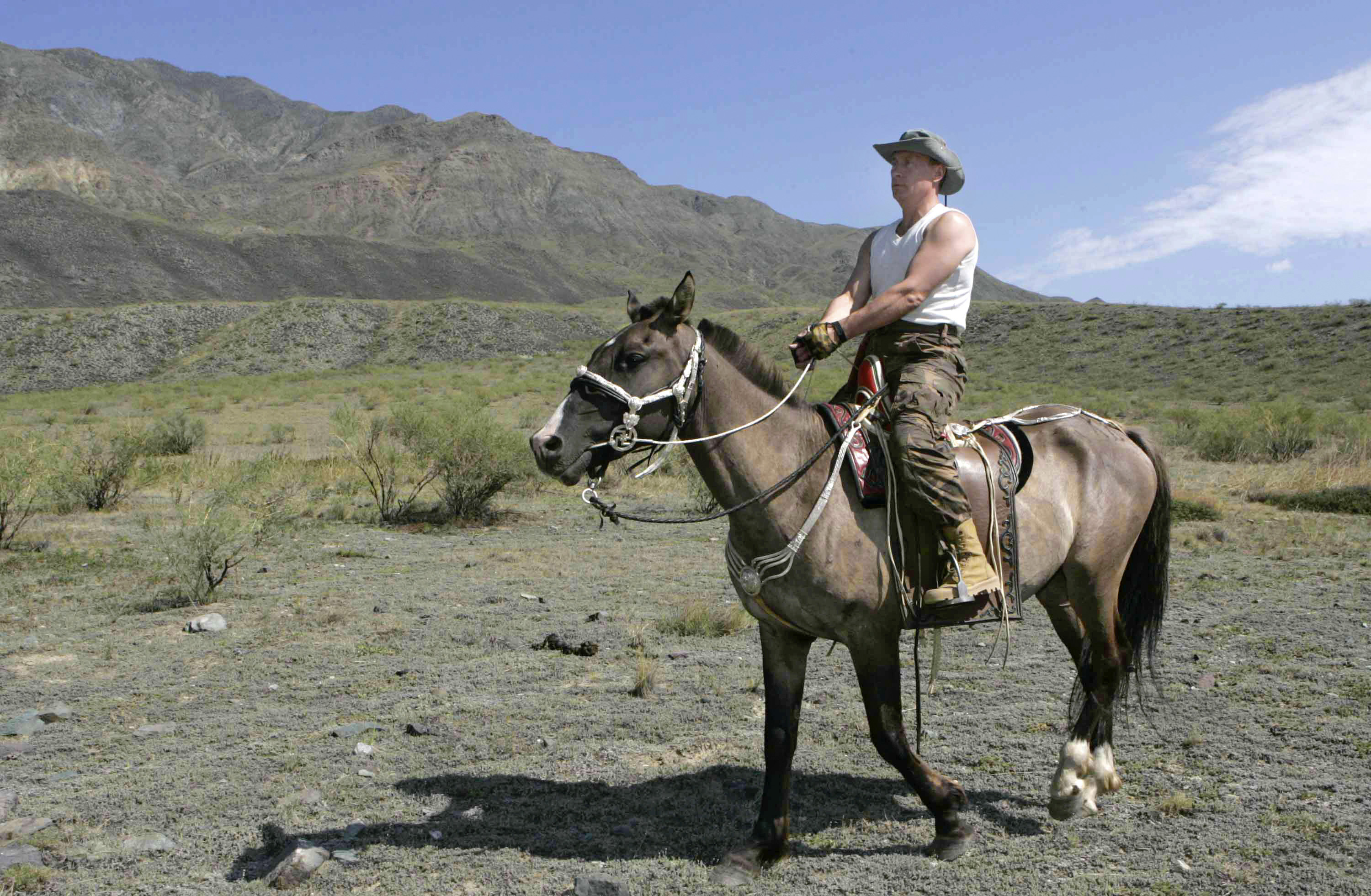 Russian President Vladimir Putin rides a horse near the Western Sayan Mountains in southern Siberia's Tuva region in August 2007