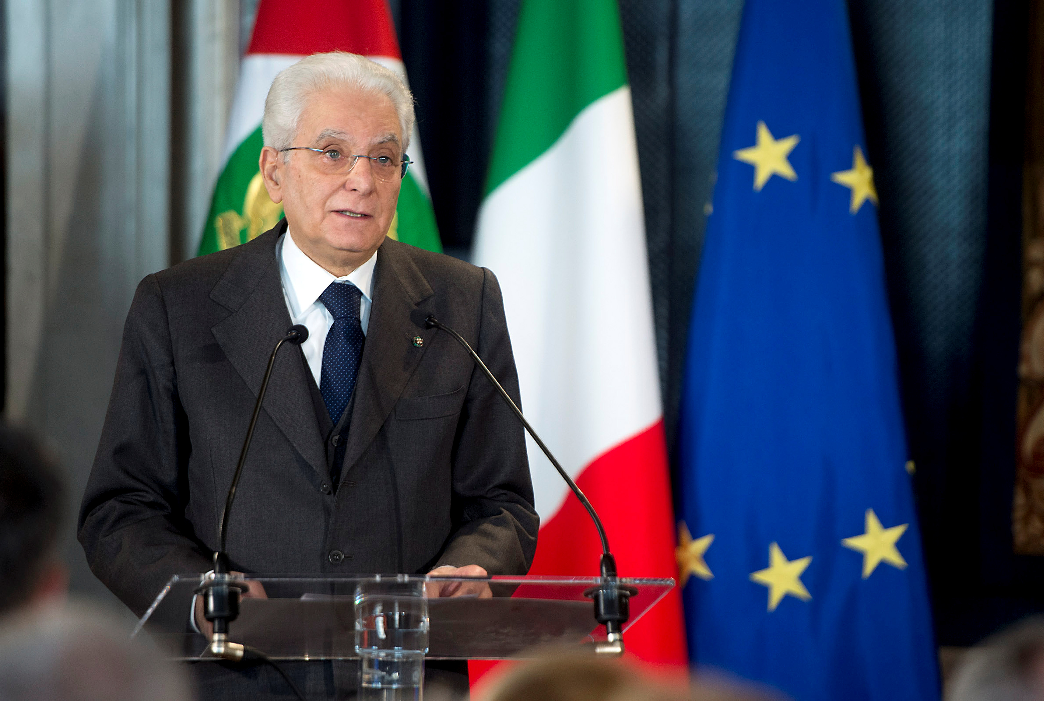 Sergio Mattarella delivers an address from a podium