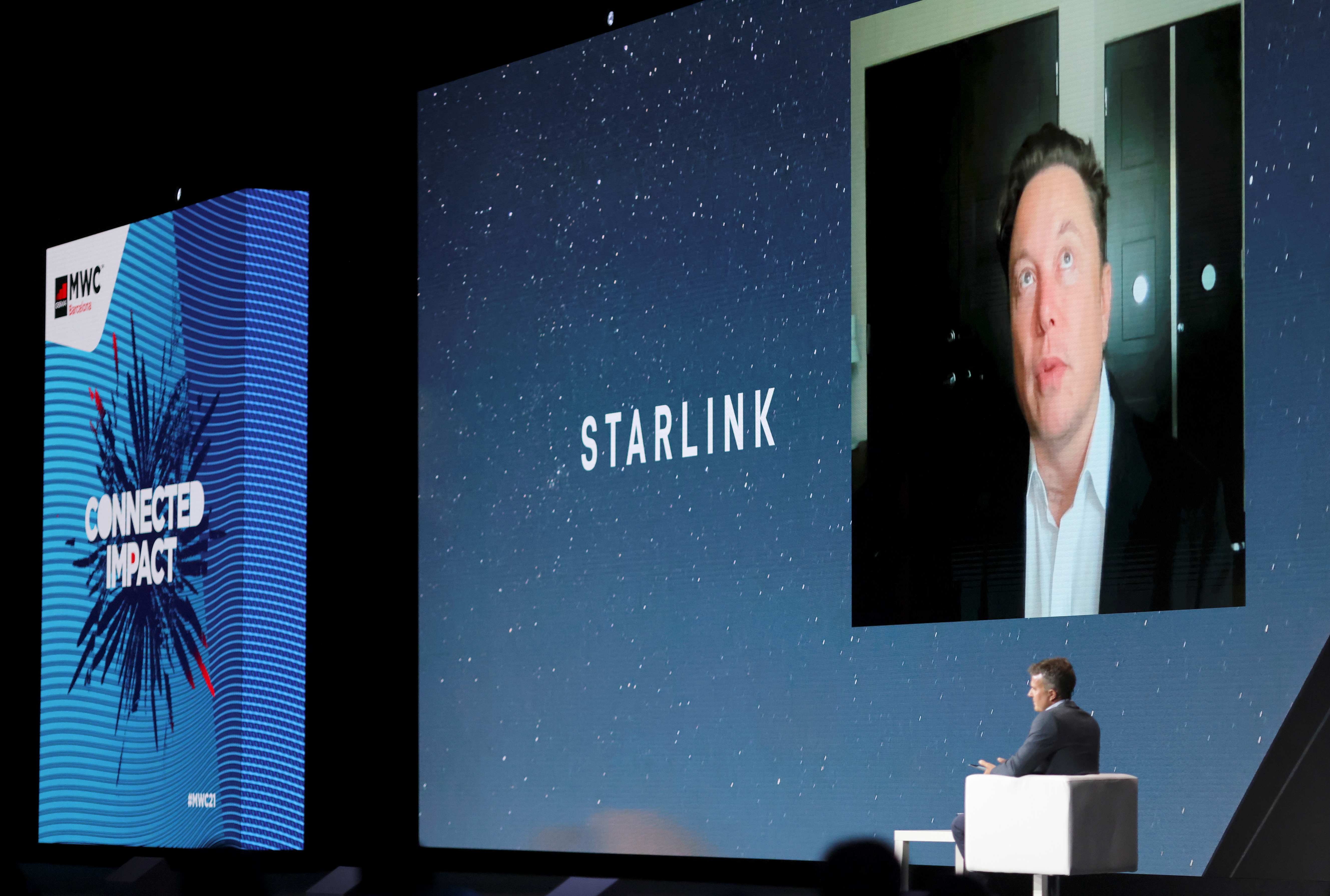 SpaceX founder and Tesla CEO Elon Musk speaks on a screen during the Mobile World Congress in Barcelona