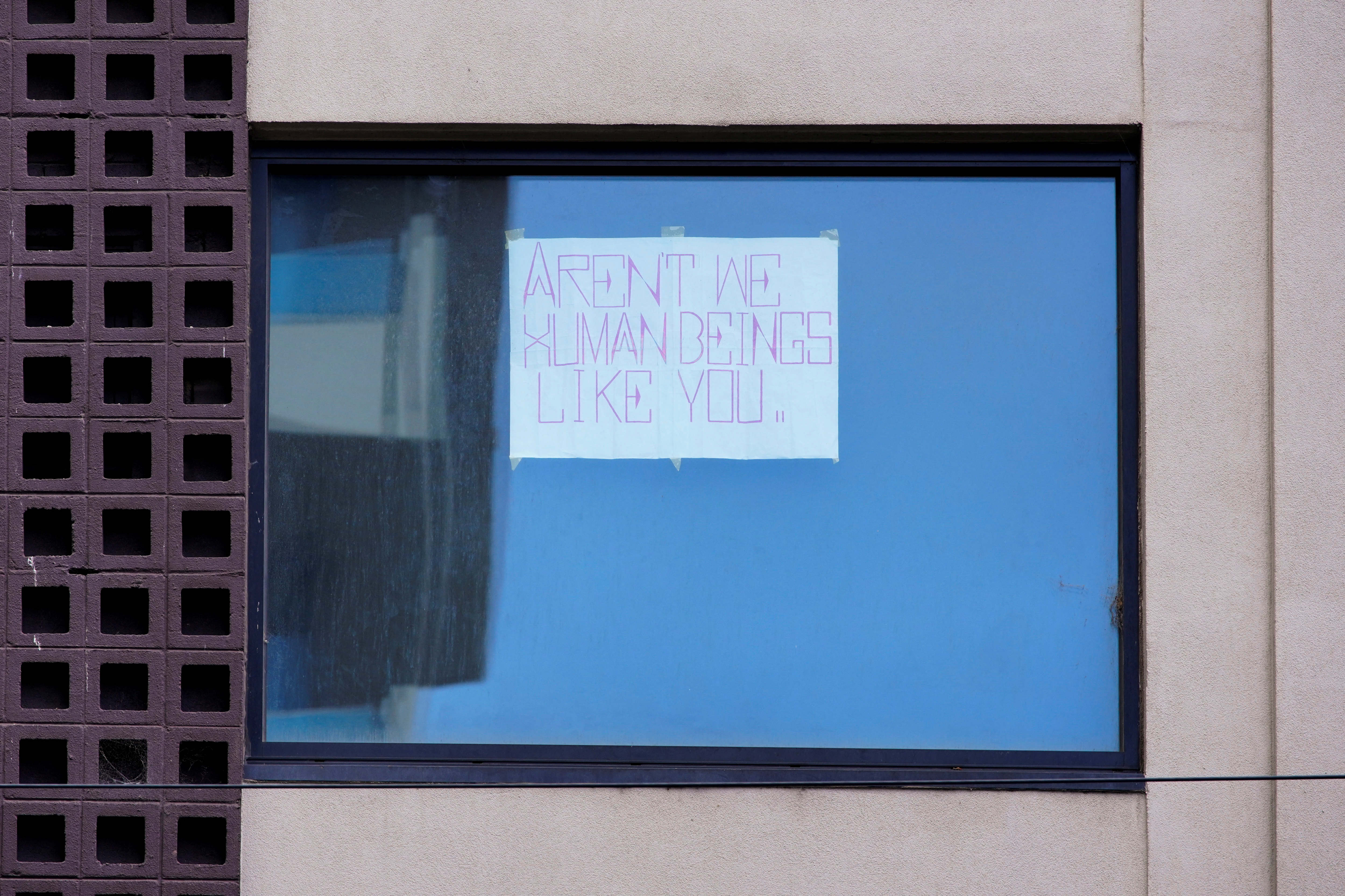 A sign is seen in the window of the Park Hotel that.