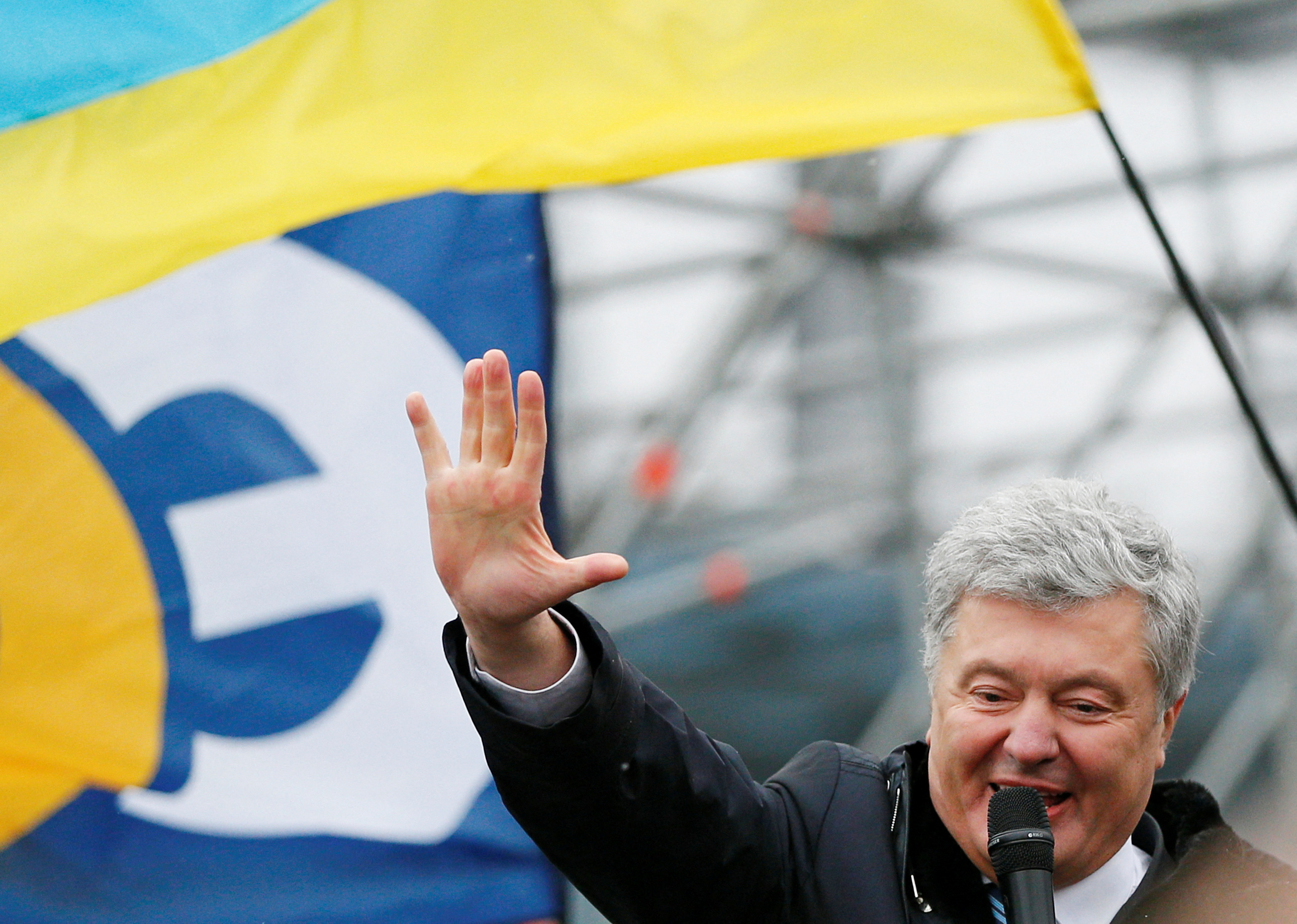 Ukraine's former President Petro Poroshenko addresses his supporters at Zhulyany airport in Kyiv, Ukraine