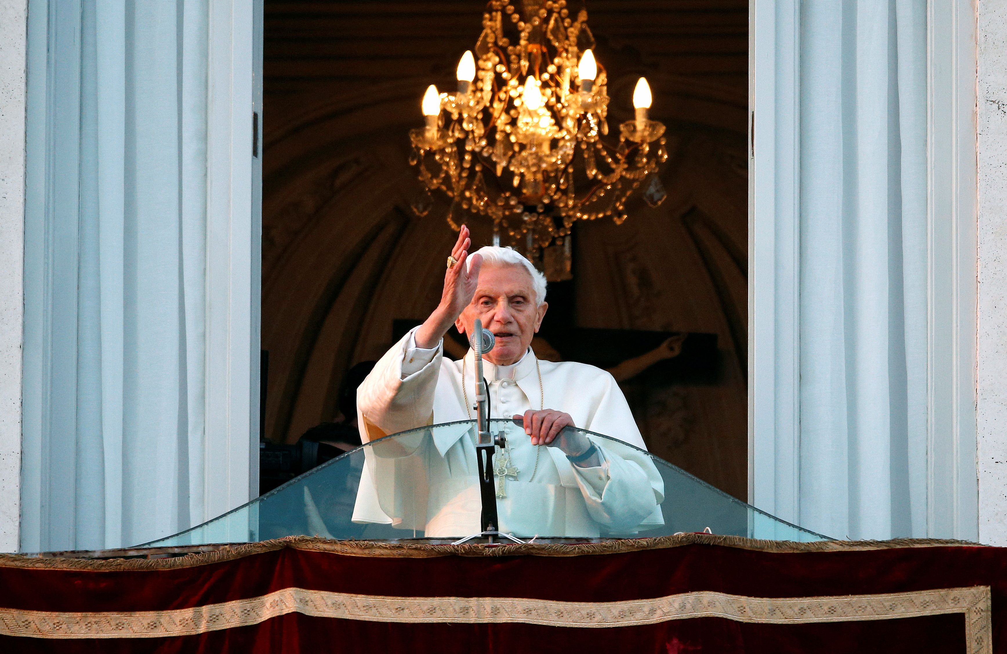 Pope Benedict XVI blesses the faithful for the last time from the balcony of his summer residence in Castel Gandolfo February 28, 2013.