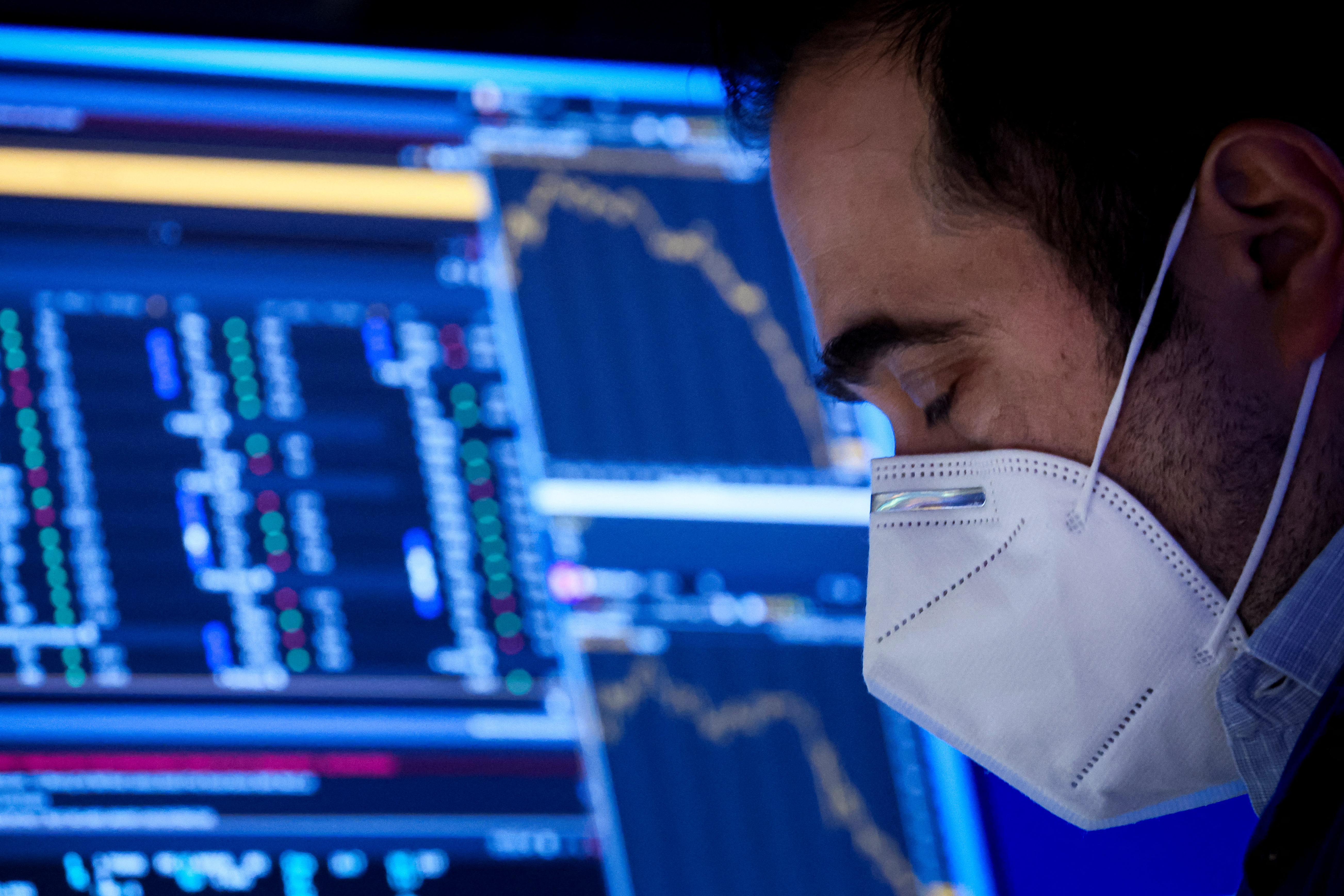 A Specialist Trader works inside his post on the floor of the New York Stock Exchange (NYSE) in New York City