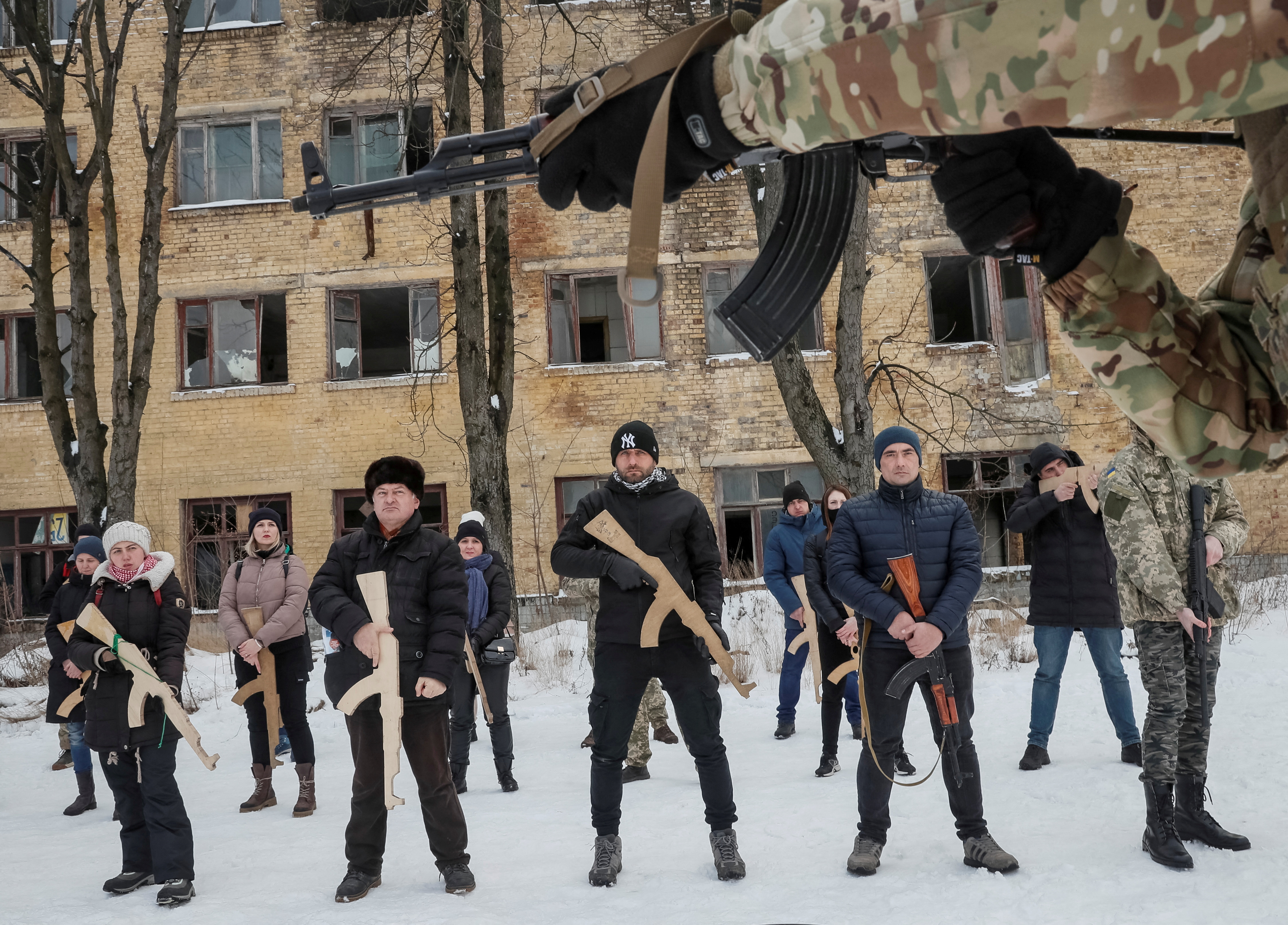 A veteran of the Ukrainian National Guard Azov battalion conducts military exercises for civilians
