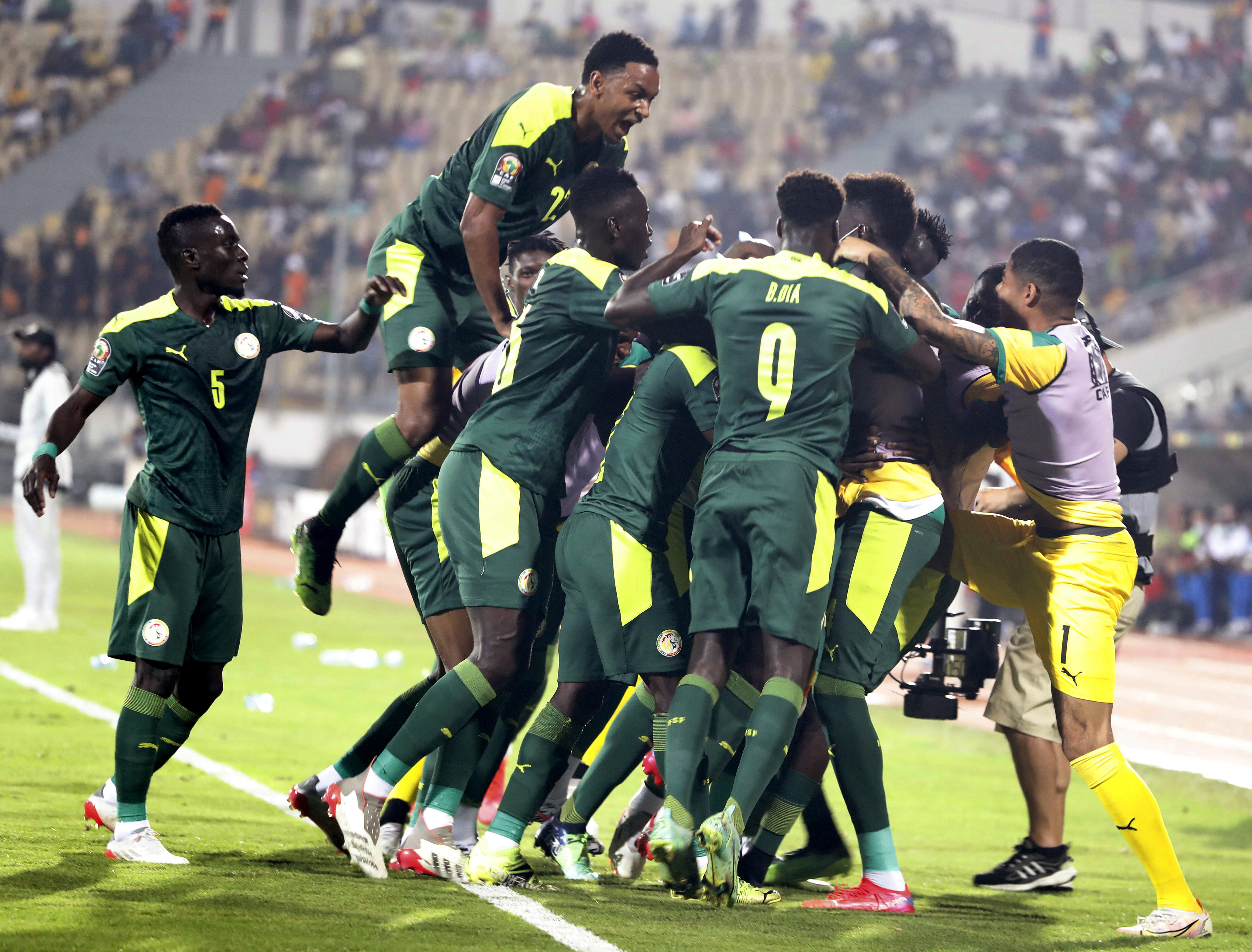 Soccer Football - Africa Cup of Nations - Quarter Final - Senegal v Equatorial Guinea - Ahmadou Ahidjo Stadium, Yaounde, Cameroon - January 30, 2022 Senegal's Famara Diedhiou celebrates scoring their first goal with teammates REUTERS/Mohamed Abd El Ghany