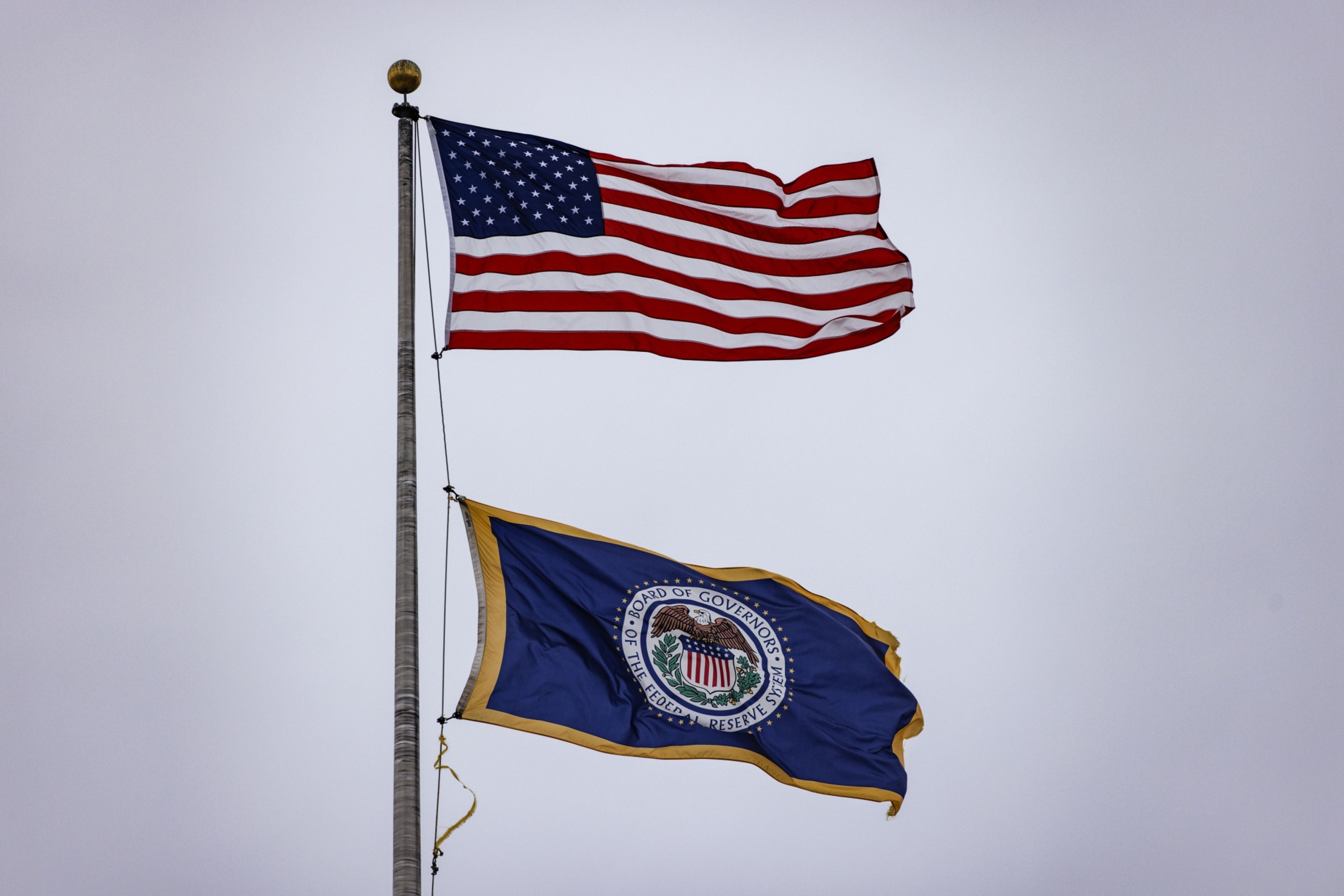 An American flag flies above the Marriner S. Eccles Federal Reserve building in Washington, D.C.