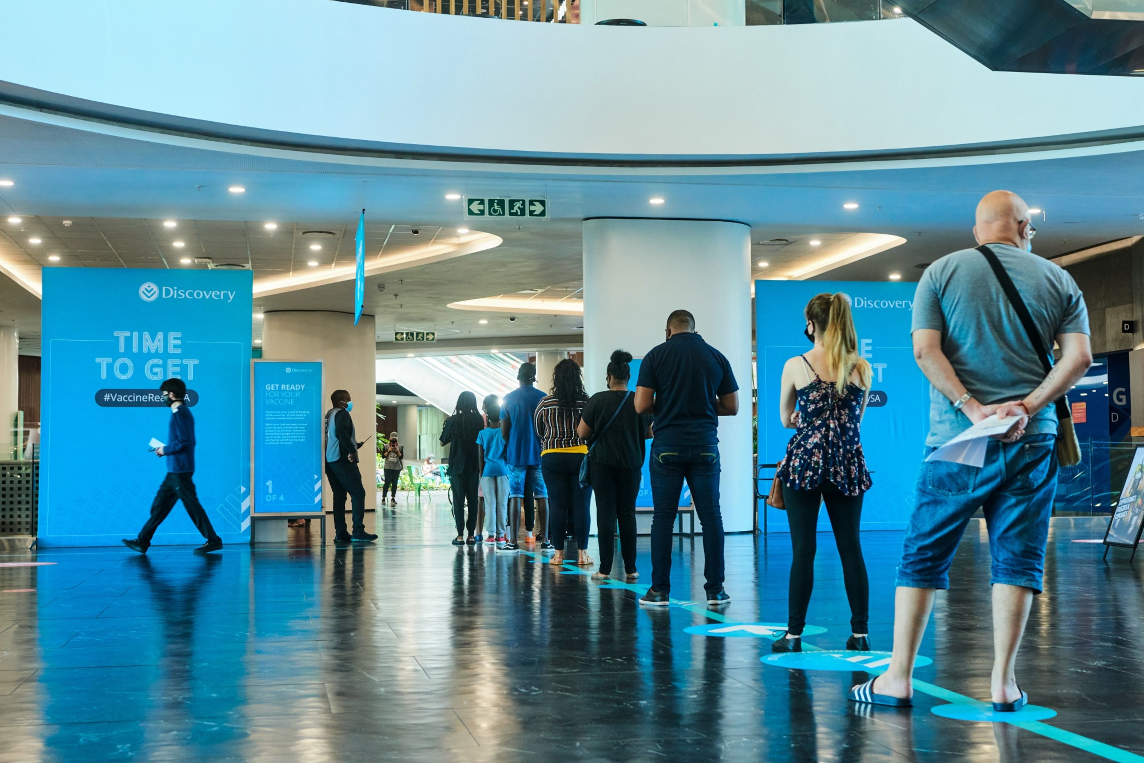 People queue for COVID-19 vaccines