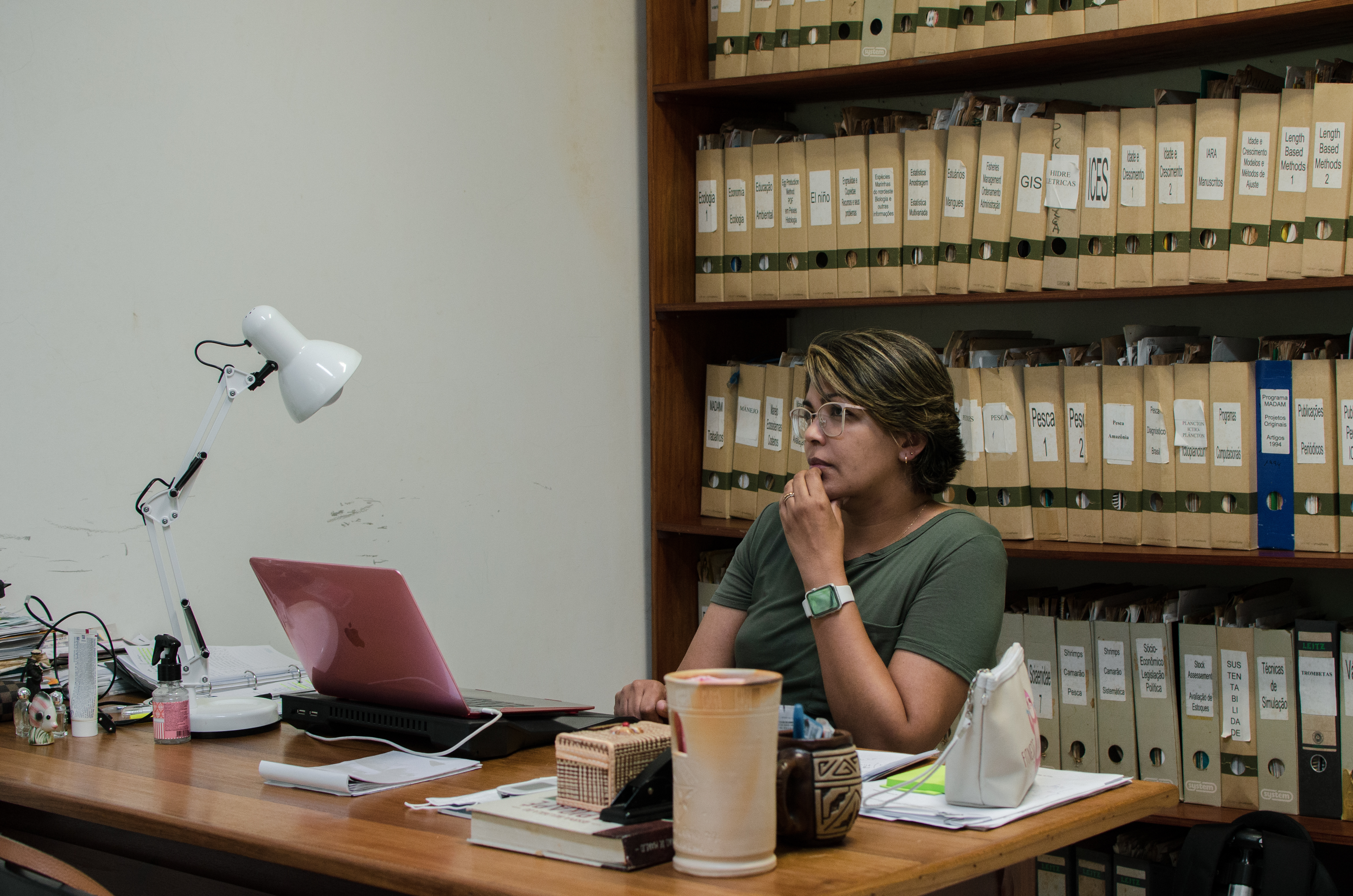 Bianca Bentes is a woman sitting at a computer with glasses