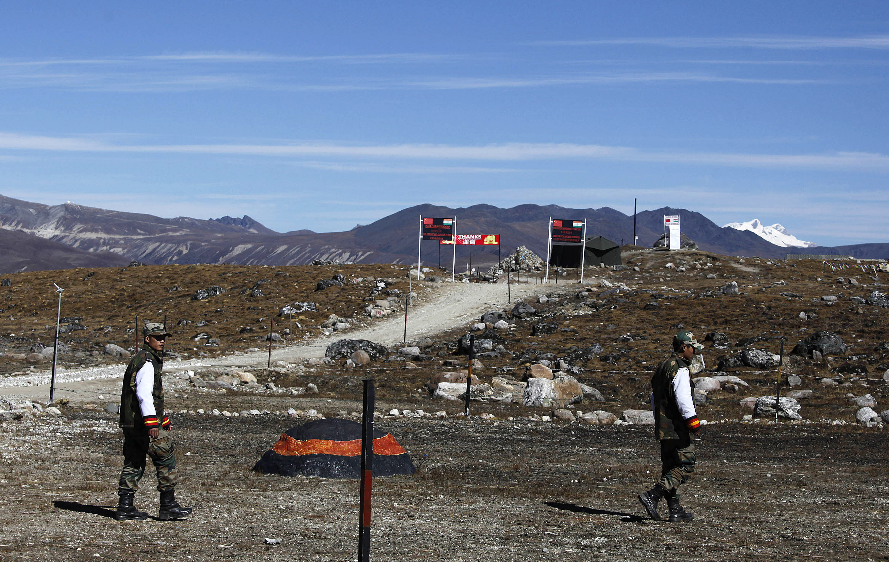 ndian army soldiers walk along the line of control at the India- China border in Bumla in the northeastern Indian state of Arunachal Pradesh